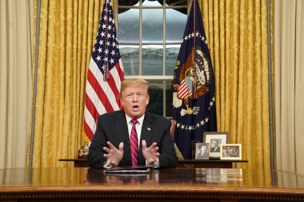 President Donald Trump speaks to the nation in his first-prime address from the Oval Office of the White House on January 8, 2019 in Washington, DC. A partial shutdown of the federal government has gone on for 17 days following the president's demand for $5.7 billion for a border wall while Democrats have refused. (Photo credit: Carlos Barria-Pool/Getty Images)