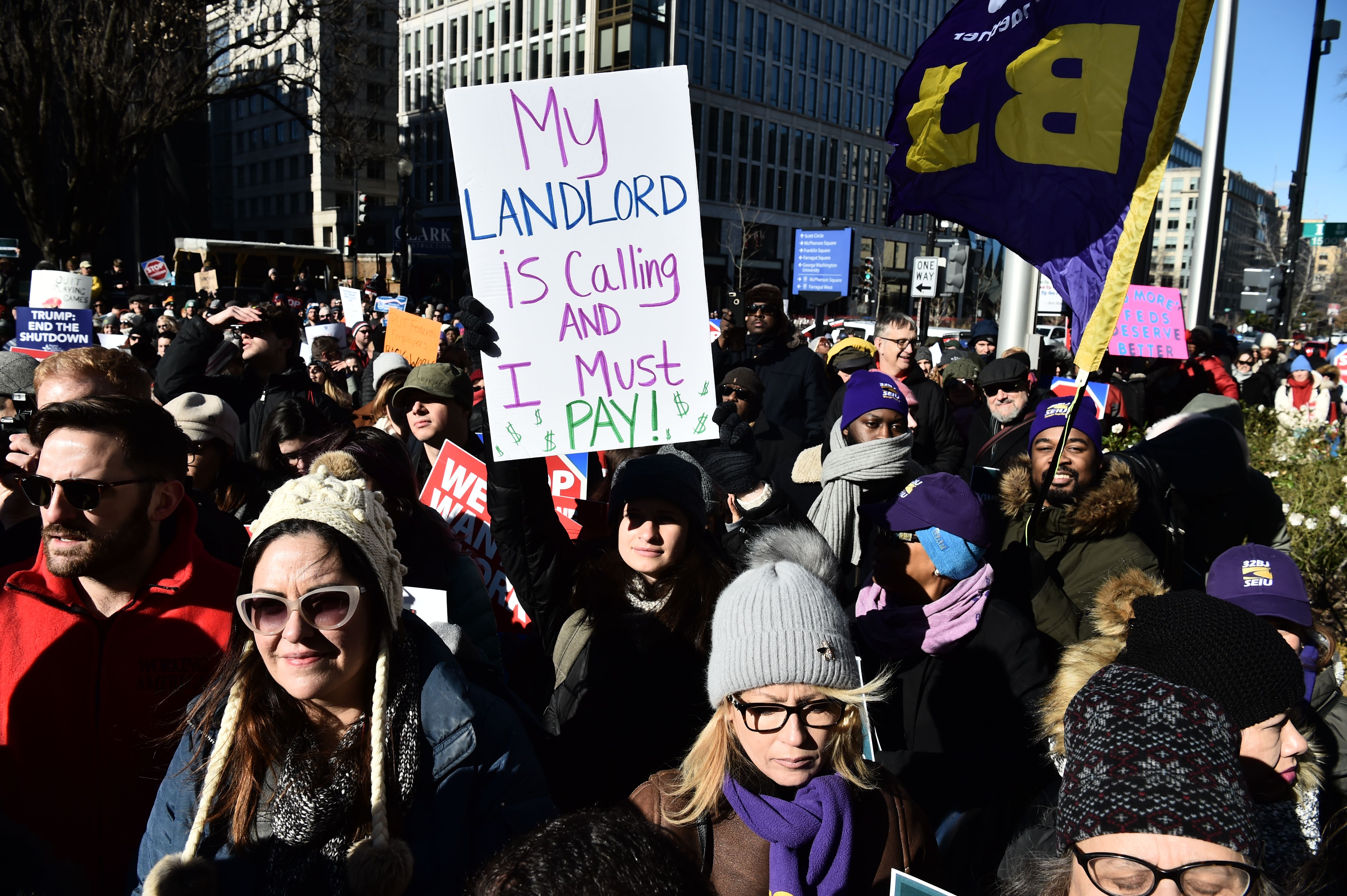 Union workers demonstrate against the government shutdown on January 10, 2019, in Washington, DC. - US President Donald Trump headed Thursday to the US-Mexico border to push his demand for a wall, a day after he walked out of negotiations with Democrats in a political crisis paralyzing the government. (Photo by Nicholas Kamm / AFP) (Photo credit should read NICHOLAS KAMM/AFP/Getty Images)