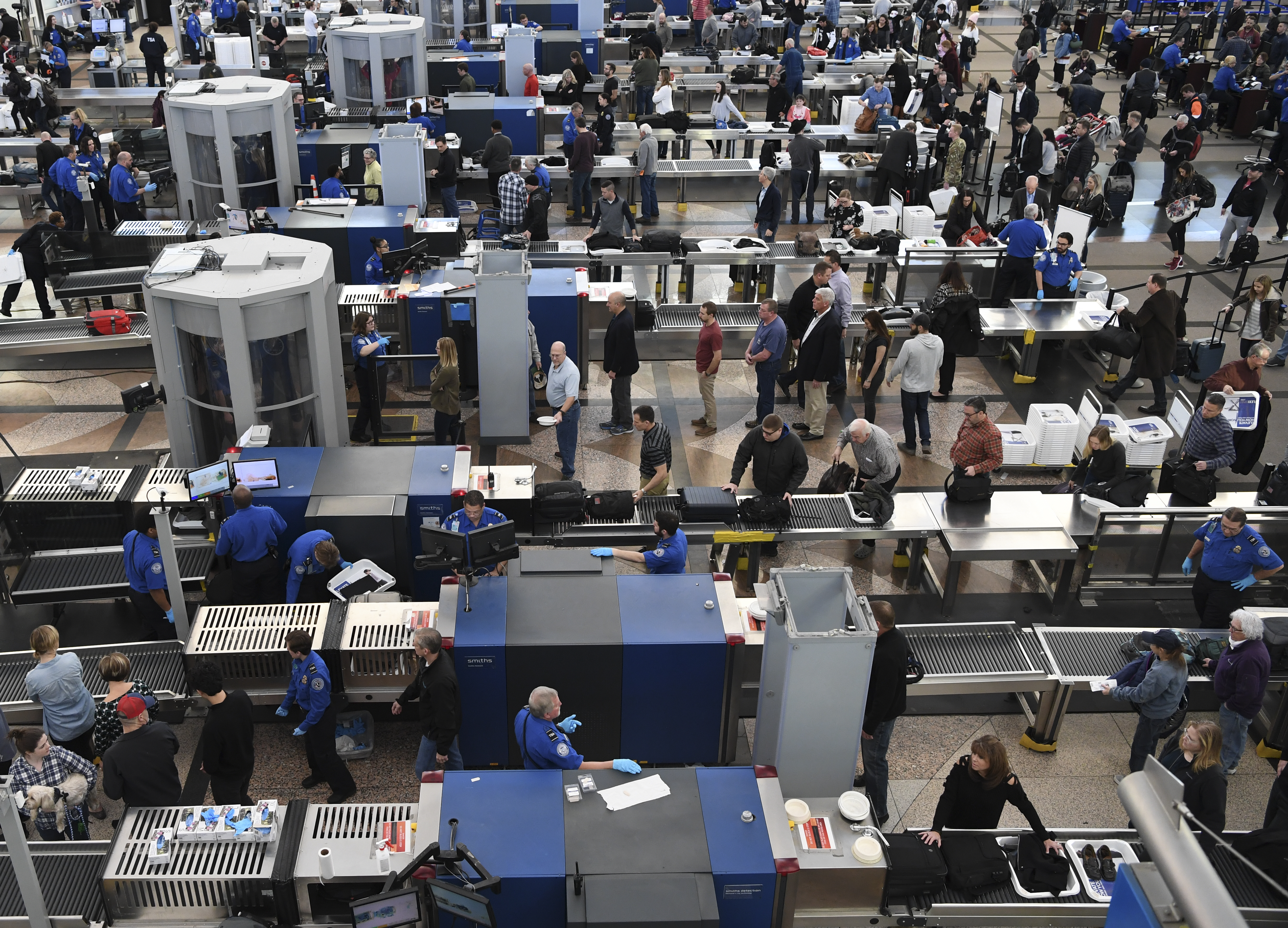 TSA agents at Denver International Airport continue to work without pay after 24 days of the partial government shutdown. (CREDIT: RJ Sangosti/The Denver Post via Getty Images)