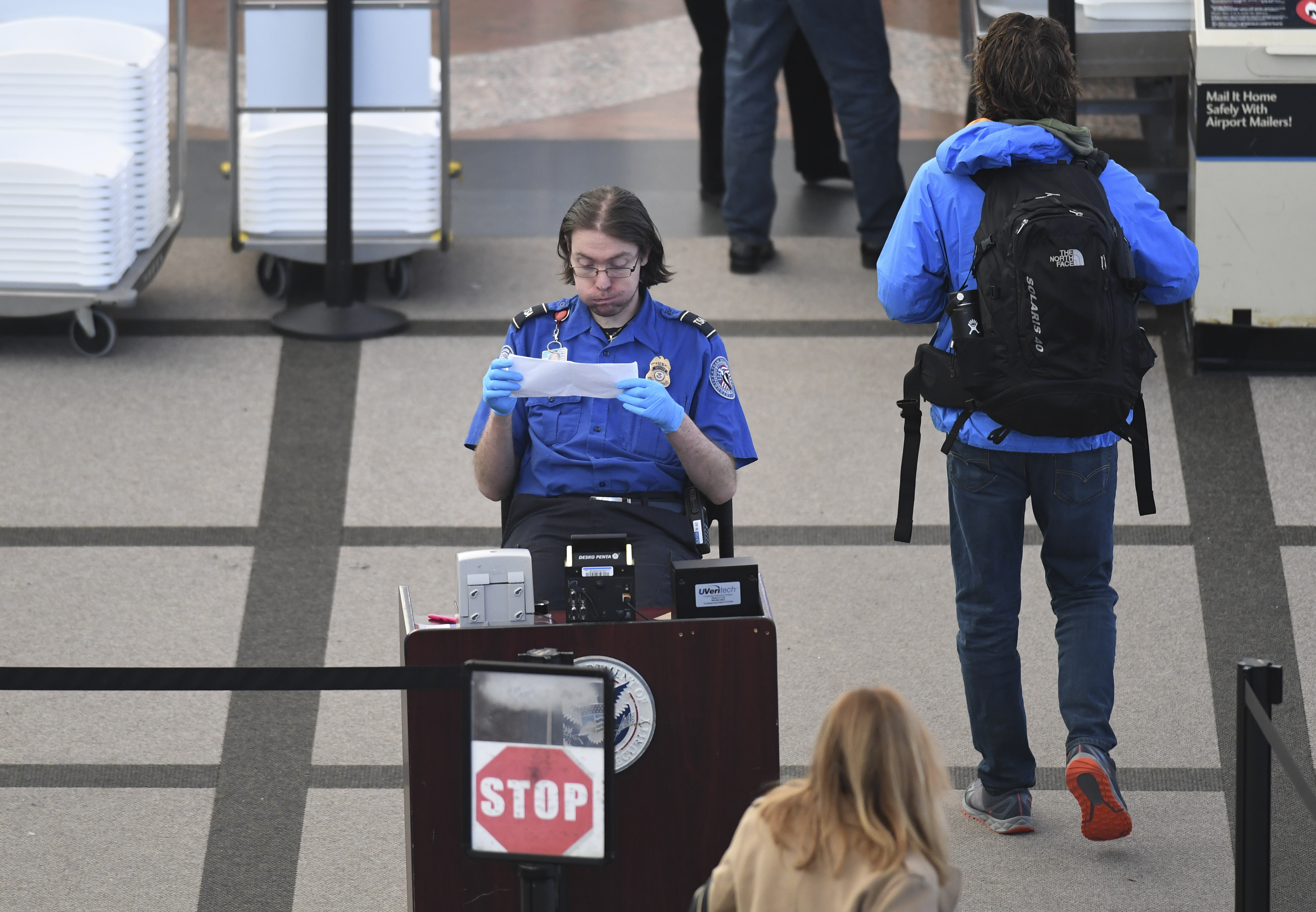 TSA agents at Denver International Airport continue to work without pay after 24 days of the partial government shutdown on January 14, 2019 in Denver, Colorado. (Photo Credit: RJ Sangosti/The Denver Post via Getty Images)
