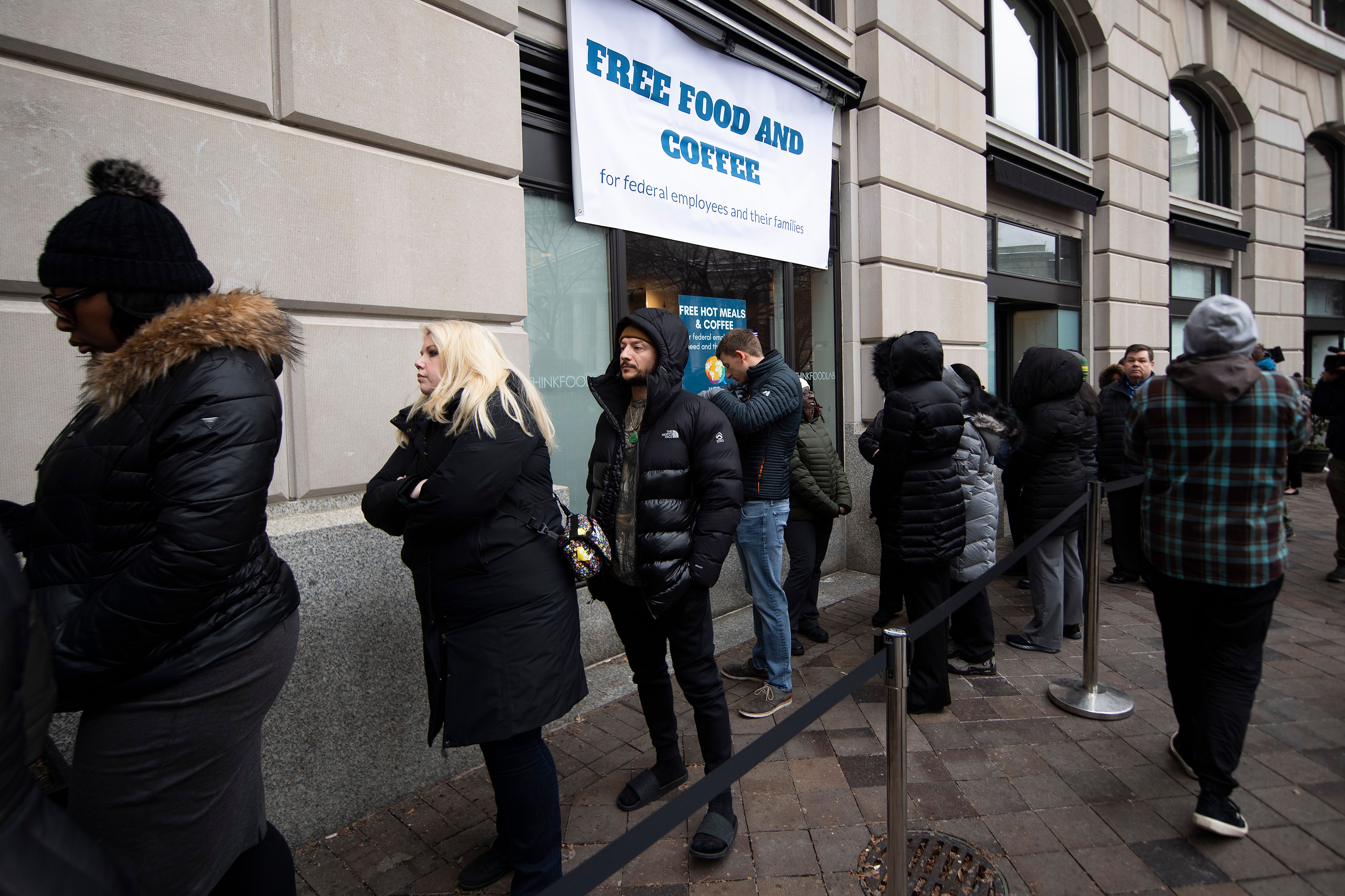 Customers wait in line outside a restaurant opened by chef Jose Andres for federal workers and their families during a partial government shutdown in Washington, D.C. It's unquestionably a kind gesture. But is this "good news?" (Photo by JIM WATSON/AFP/Getty Images)