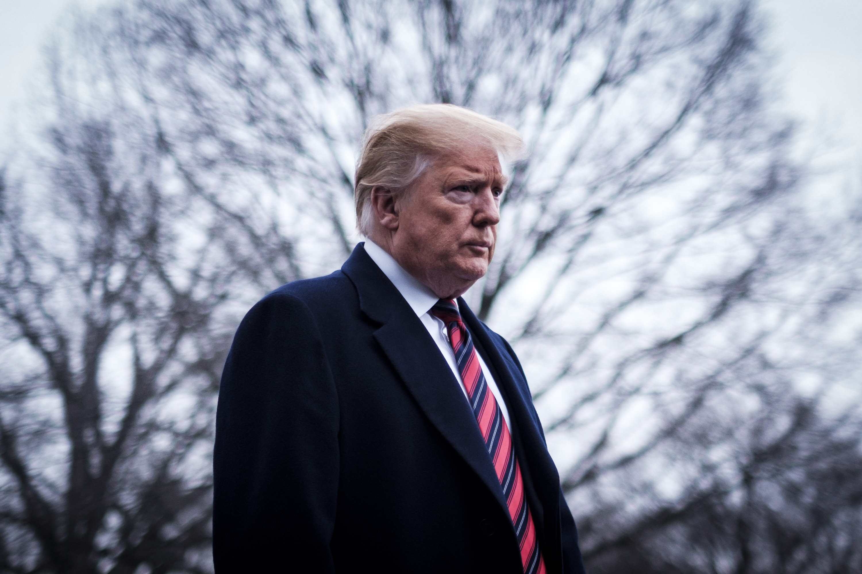 WASHINGTON, DC - JANUARY 19: U.S. President Donald Trump stops to speak to reporters as he prepared to board Marine One on the South Lawn of the White House on January 19, 2019 in Washington, DC. Trump is traveling to Dover Air Force Base in Delaware to visit with families four Americans who were killed in an explosion Wednesday in Syria. (Photo by Pete Marovich/Getty Images)