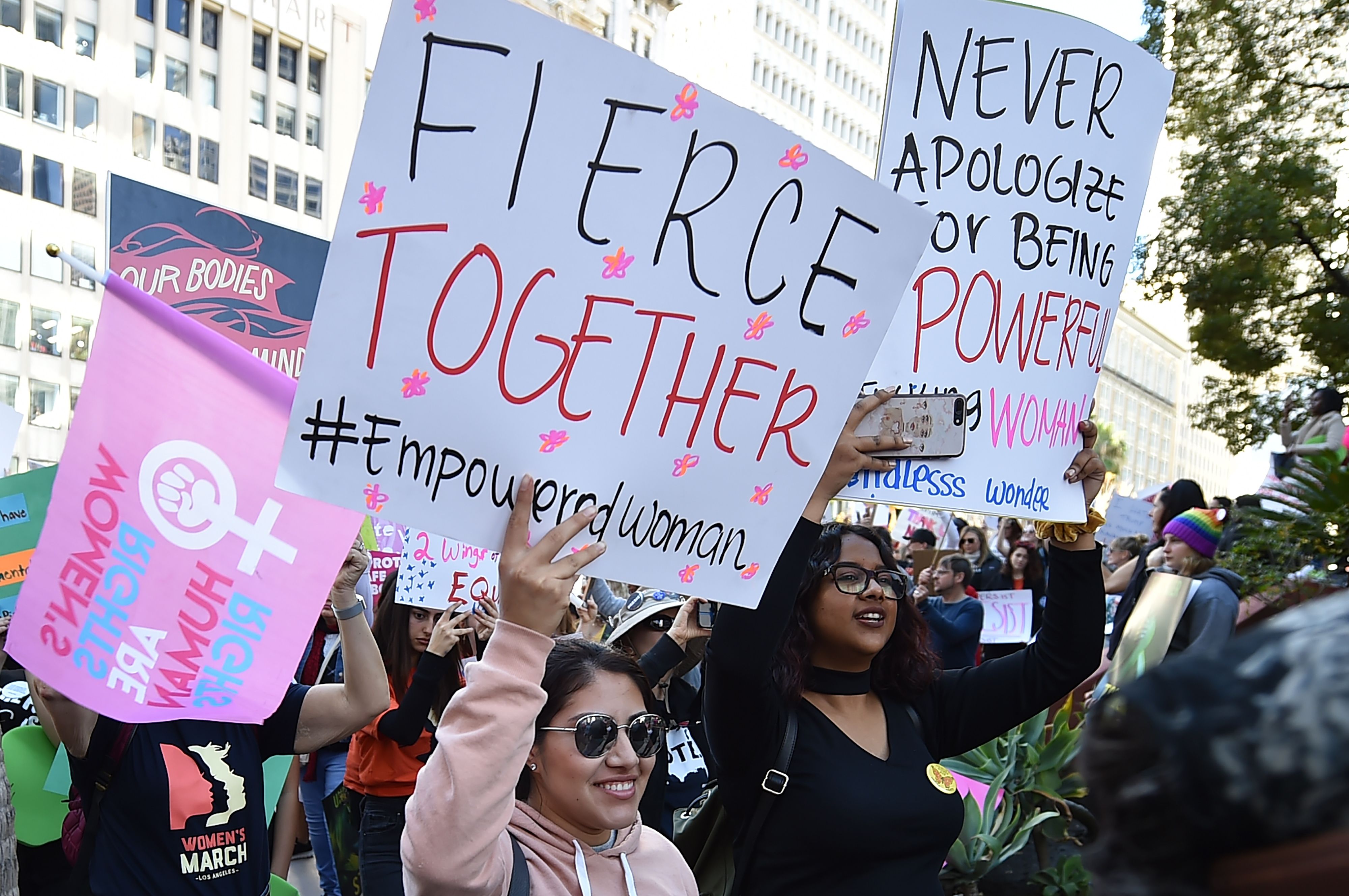 Protestors march to City Hall during the Third Annual Women's March LA, in downtown Los Angeles, California on January 19, 2019. - Thousands of women gathered across the United States for their annual message opposing Donald Trump and supporting women's rights. CREDIT: ROBYN BECK/AFP/Getty Images)