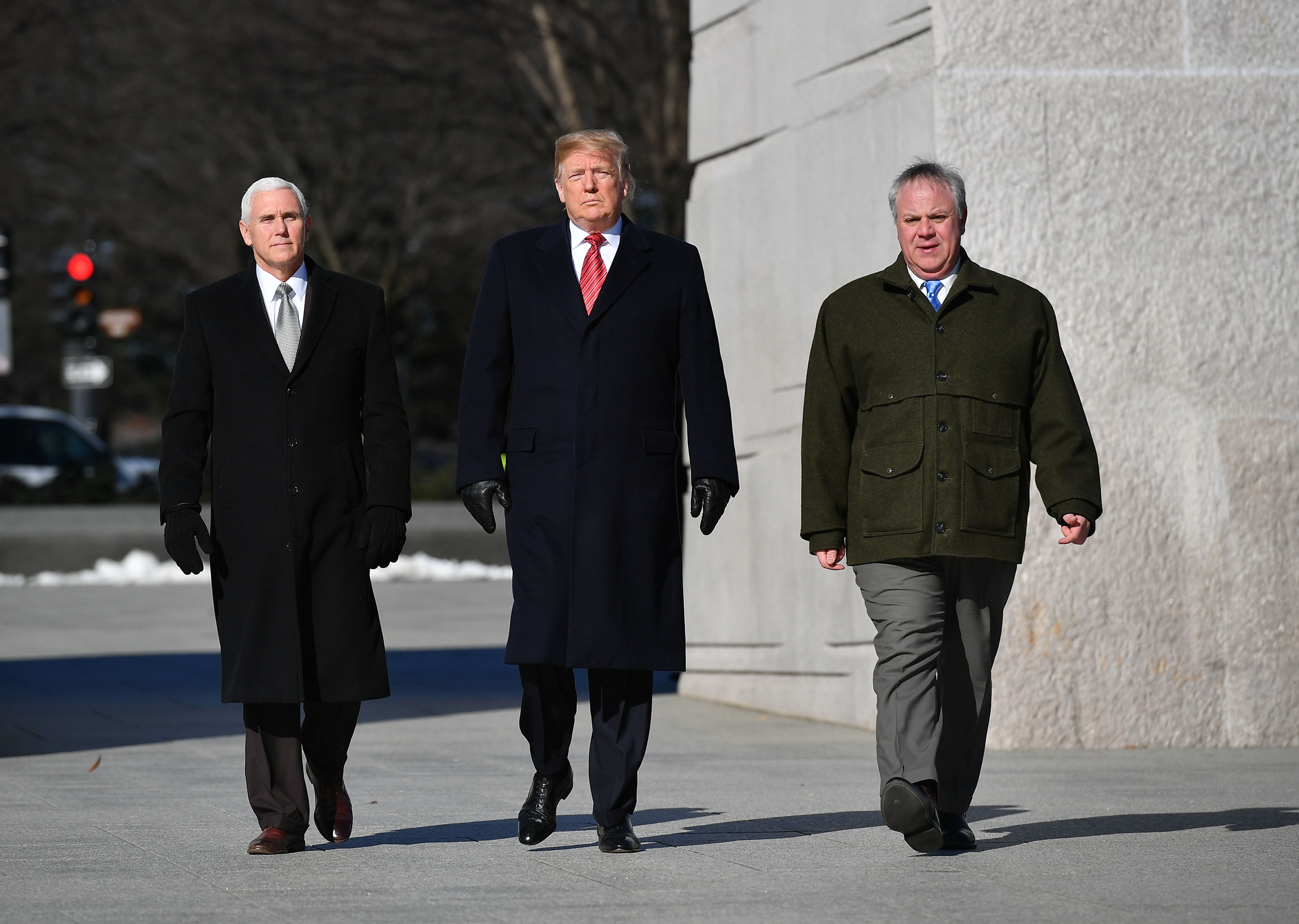 US President Donald Trump, Vice President Mike Pence (L) and acting Interior Secretary David Bernhardt visit the Martin Luther King Jr. Memorial in Washington, DC on January 21, 2019 on Martin Luther King Day. (Photo by MANDEL NGAN / AFP) (Photo credit should read MANDEL NGAN/AFP/Getty Images)