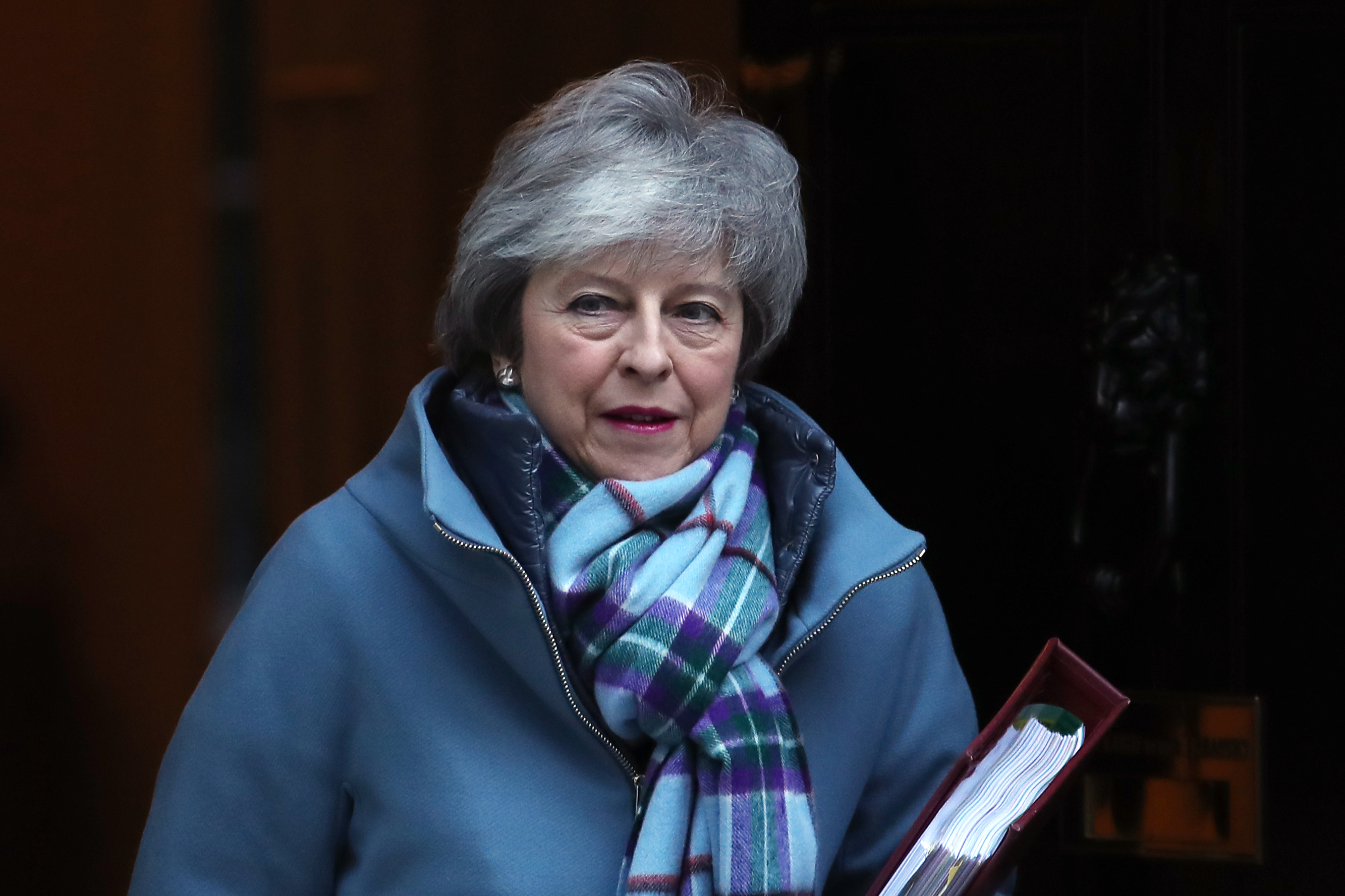 The House of Commons narrowly voted this week to approve two amendments to May's much-maligned Brexit deal -- neither of which solve many problems. (Photo credit: DANIEL LEAL-OLIVAS/AFP/Getty Images)