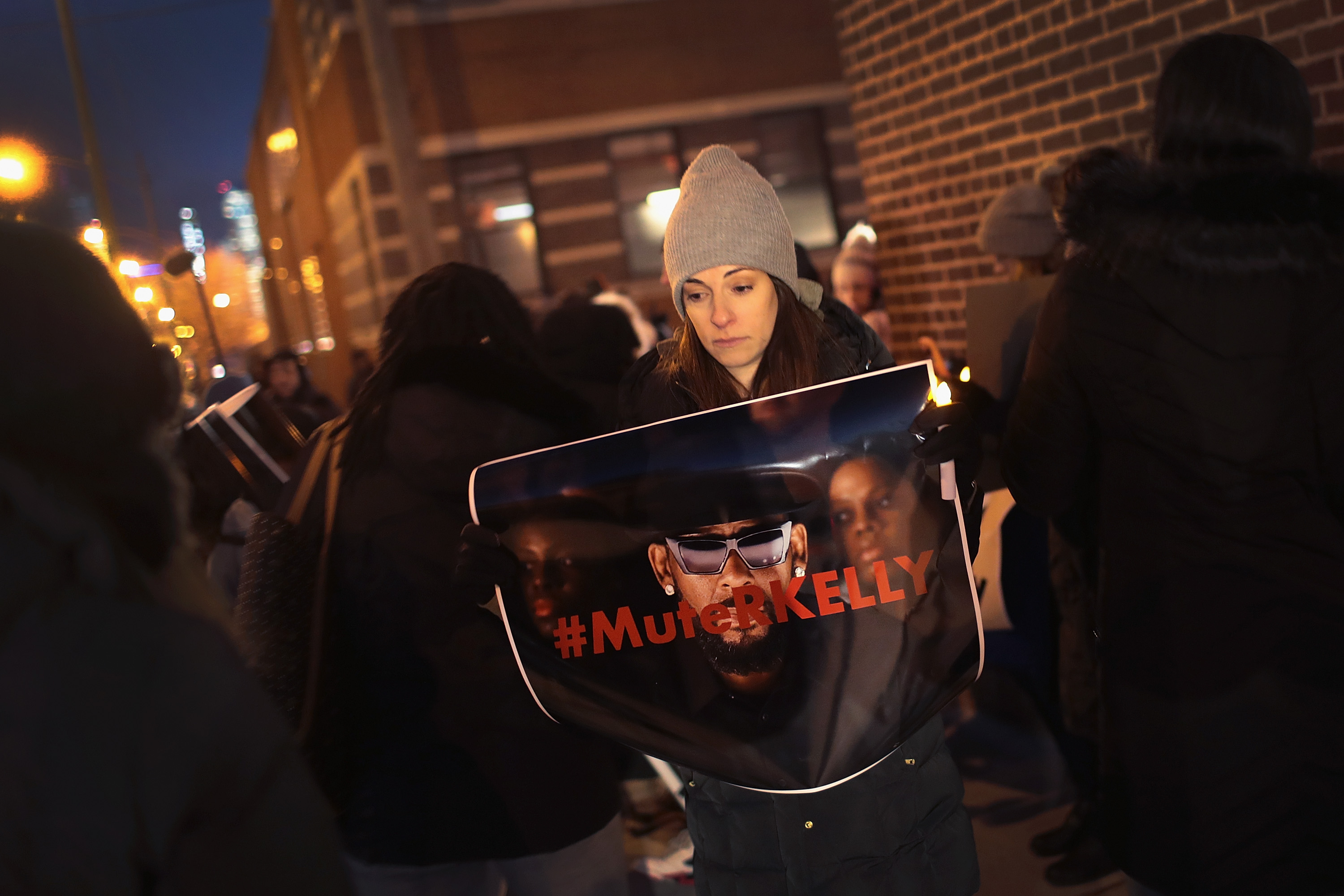 Demonstrators gather near the studio of singer R. Kelly to call for a boycott of his music after allegations of sexual abuse against young girls were raised on the highly-rated Lifetime mini-series 'Surviving R. Kelly.' (Photo by Scott Olson/Getty Images)