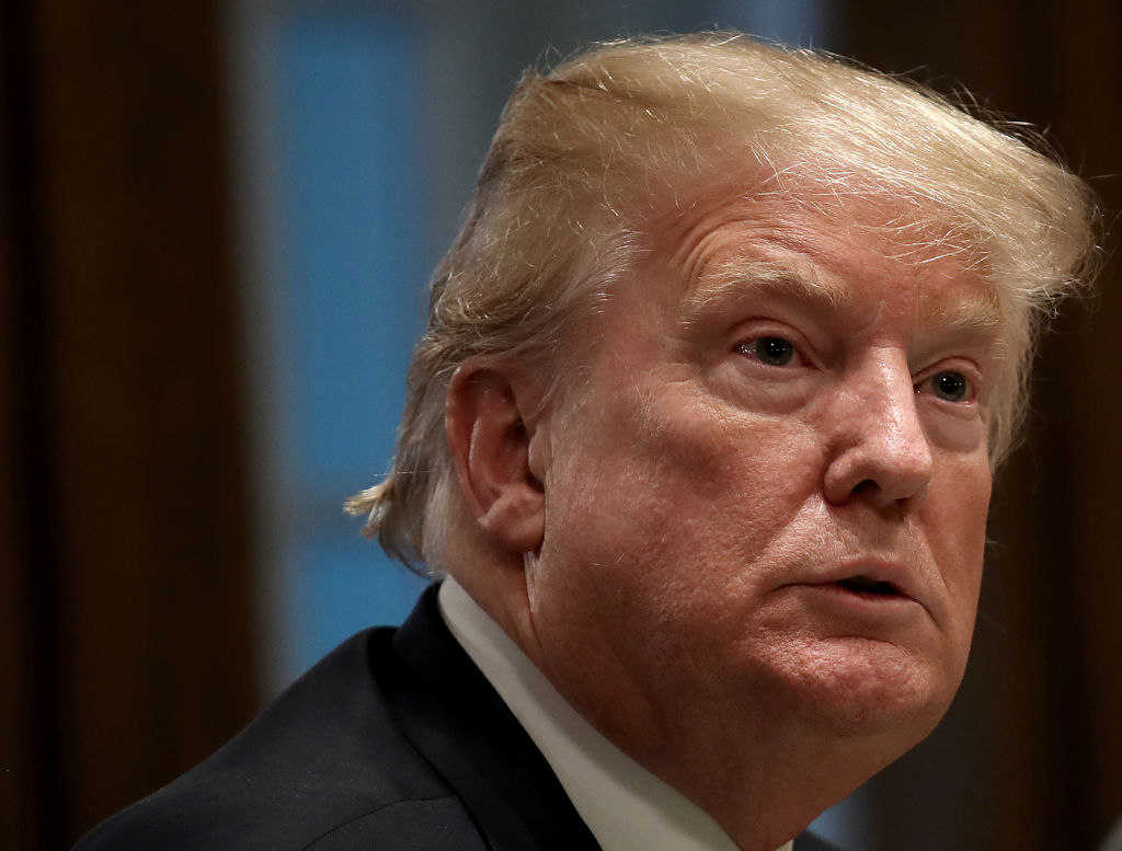 The White House has reached a temporary deal with Congress to re-open the government and end the 35-day long partial shutdown, President Donald Trump announced Friday afternoon. (Photo credit: Win McNamee/Getty Images)
