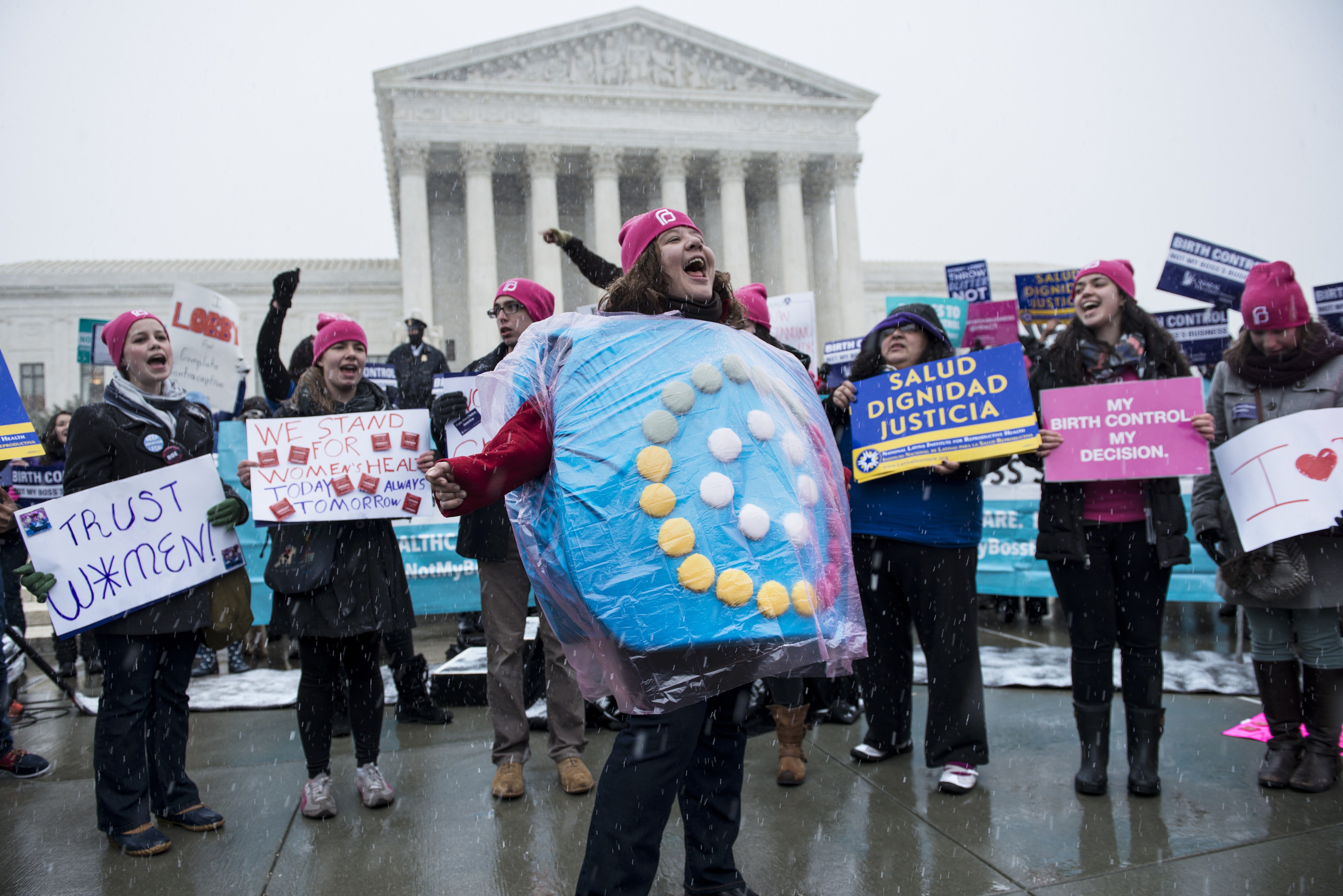 Activists rally against Hobby Lobby's choice to deny contraceptive healthcare coverage to its employees outside the Supreme Court March 25, 2014 in Washington, DC. The Supreme Court will hear arguments today if Hobby Lobby and other for profit corporations can refuse to cover contraceptive services in their employee's healthcare for religious reasons. AFP PHOTO/Brendan SMIALOWSKI (Photo credit should read BRENDAN SMIALOWSKI/AFP/Getty Images)