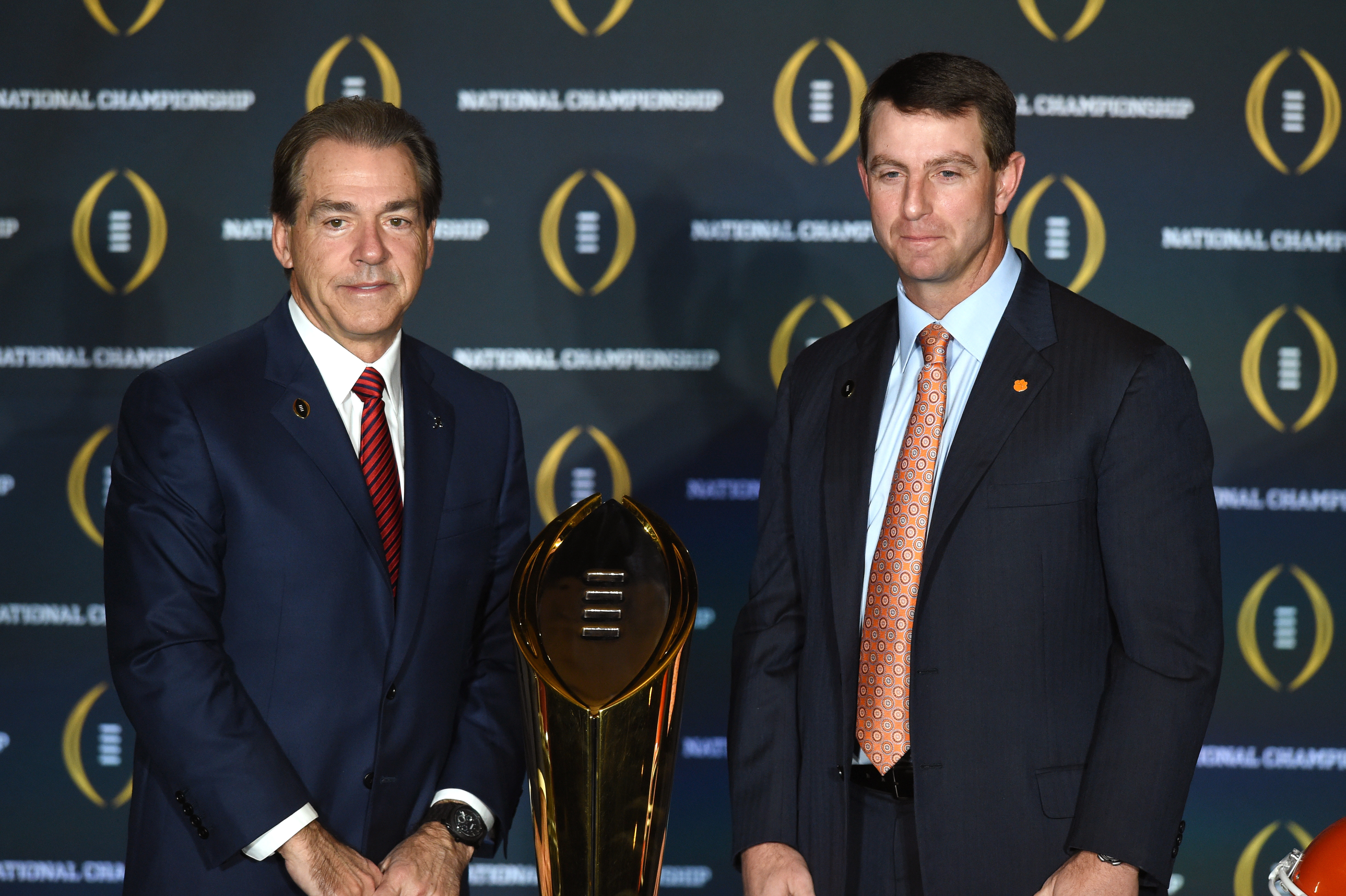10 January 2016: Alabama head coach Nick Saban and Clemson head coach Dabo Swinney pose with the National Championship Trophy during the head coaches press conference for the College Football Playoff National Championship at the JW Marriott Camelback Inn in Scottsdale, AZ. (Photo by Chris Williams/Icon Sportswire) (Photo by Chris Williams/Icon Sportswire/Corbis via Getty Images)