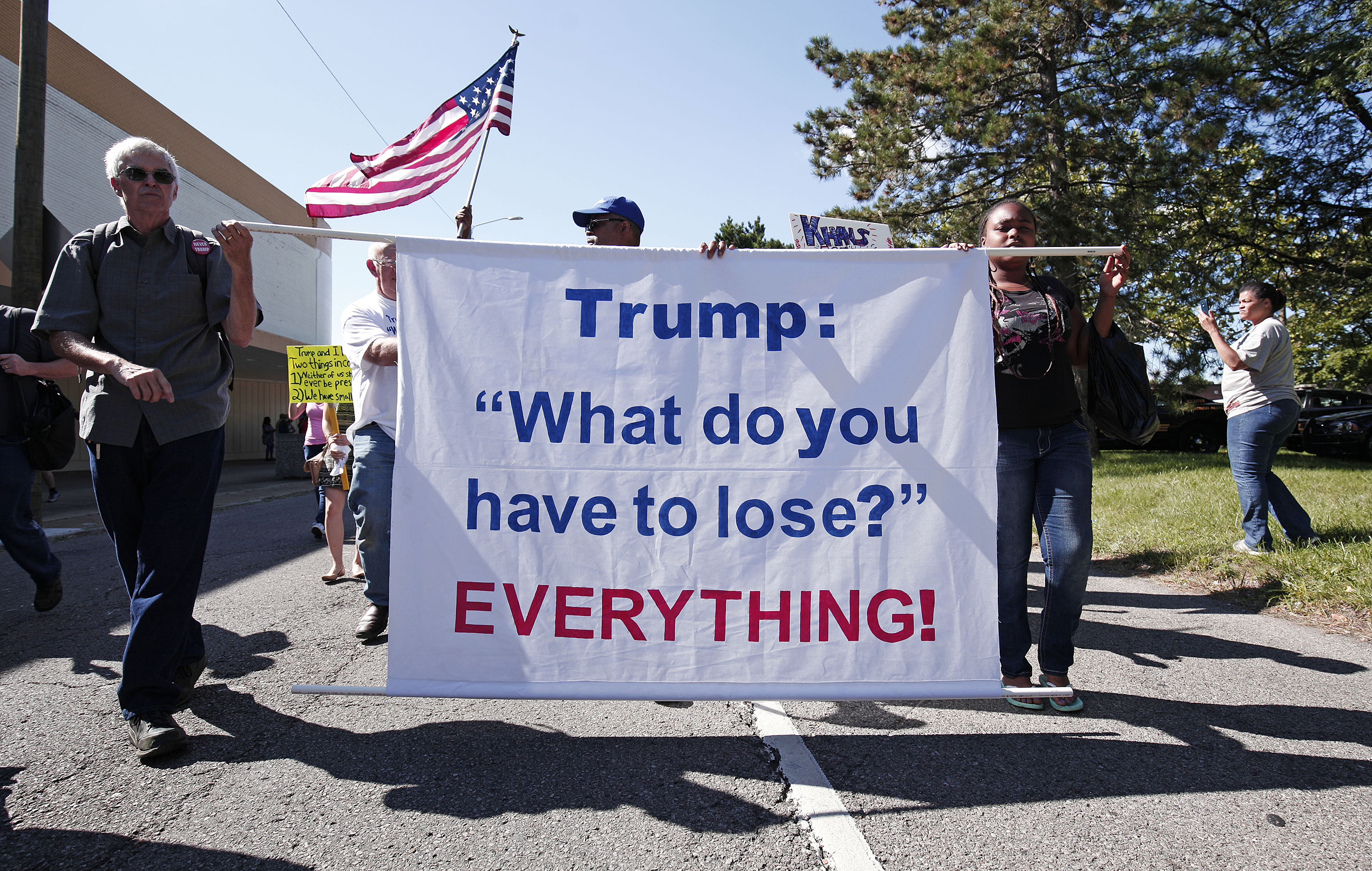 DETROIT, MI - SEPTEMBER 3: People march in protest against then- Republican Presidential Nominee Donald Trump. CREDIT: Bill Pugliano/Getty Images
