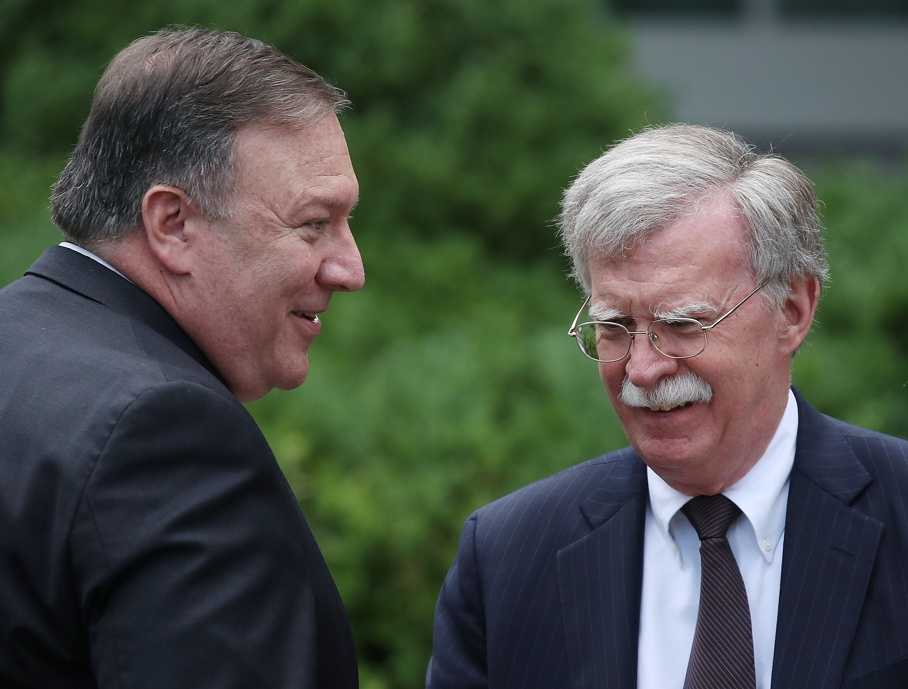 Secretary of State Mike Pompeo talks with White House National Security Advisor John Bolton in the Rose Garden at the White House, on June 7, 2018 in Washington, DC. (Photo Credit: Mark Wilson/Getty Images)