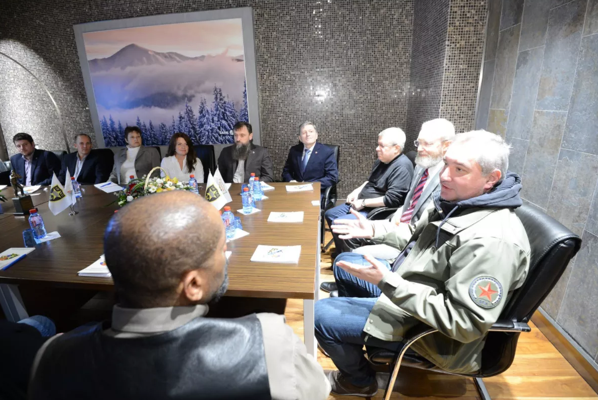 Dmitry Rogozin (right) spotted alongside Maria Butina's handler (at the back right corner) and Trump surrogate David Clarke (back to camera).