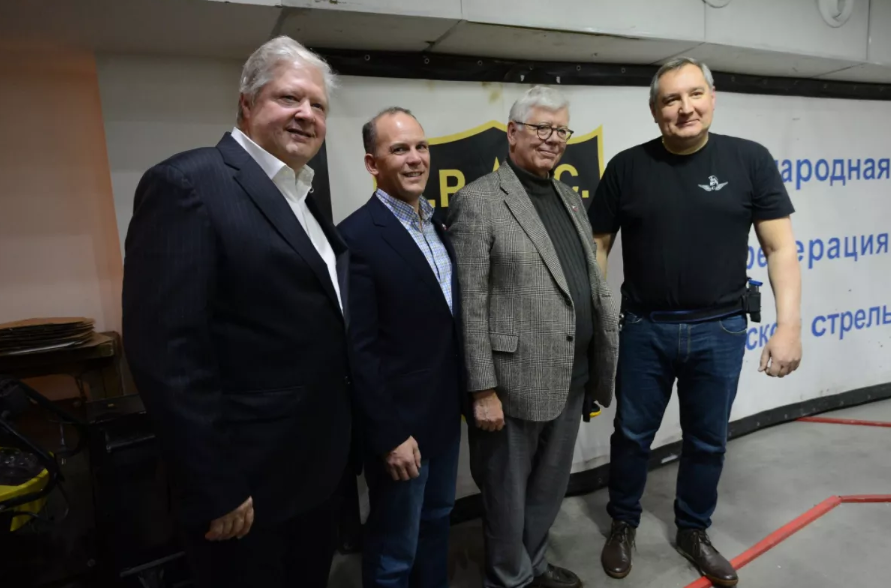 Rice University has emphatically denied that a Trump administration official will be hosting sanctioned Russian official Dmitry Rogozin (right) on campus. In this picture, the sanctioned Rogozin is shown helping host multiple NRA higher-ups in late 2015. CREDIT: TWITTER