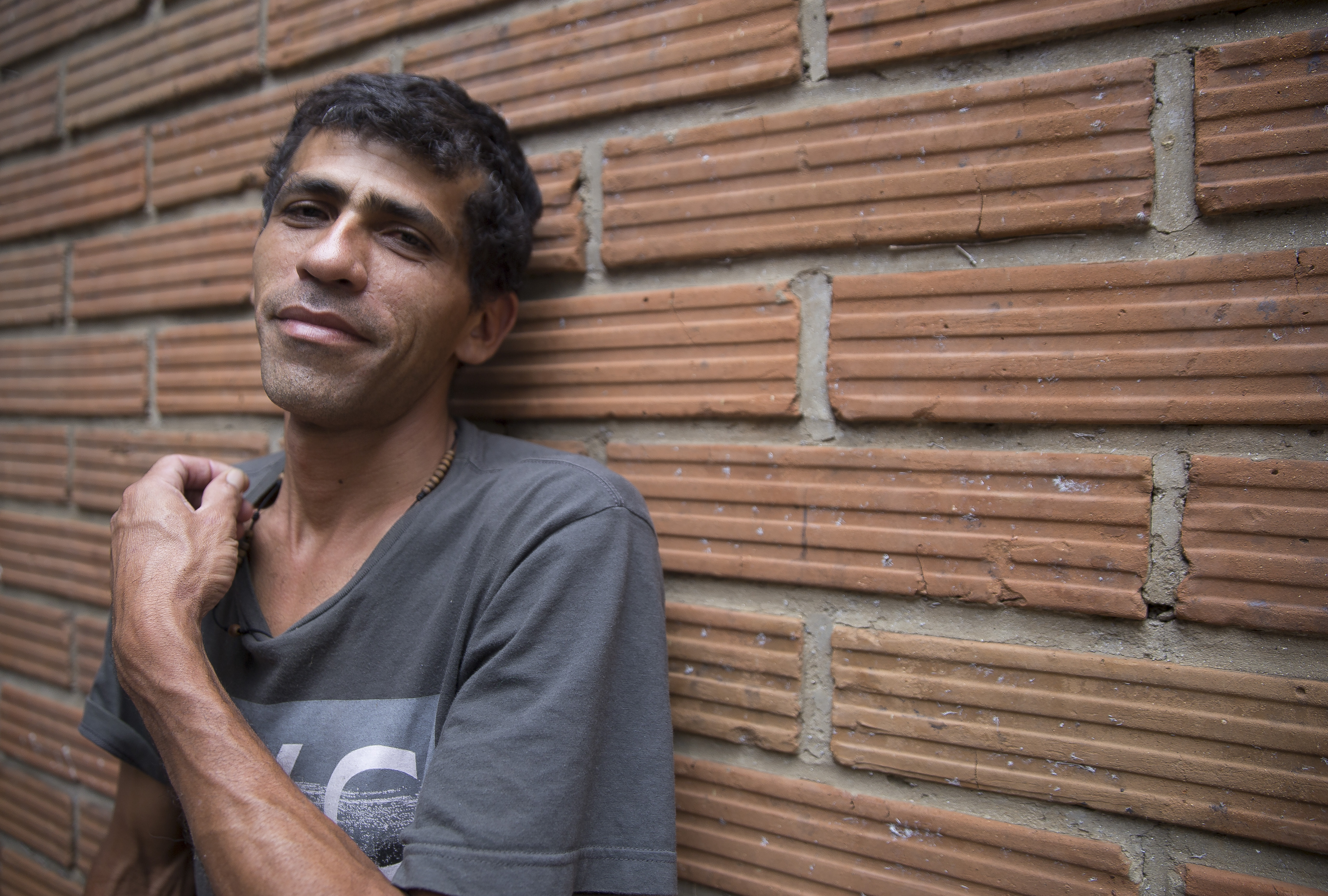 Victor Mulforo, 34, poses for a portrait in Medelln, Colombia on November 29, 2018. Mulforo migrated from Venezuela to Colombia in October, leaving his wife, daughter in the country in the midsts of economic collapse in order to work and send money home. (Credit: Megan Janetsky for ThinkProgress)