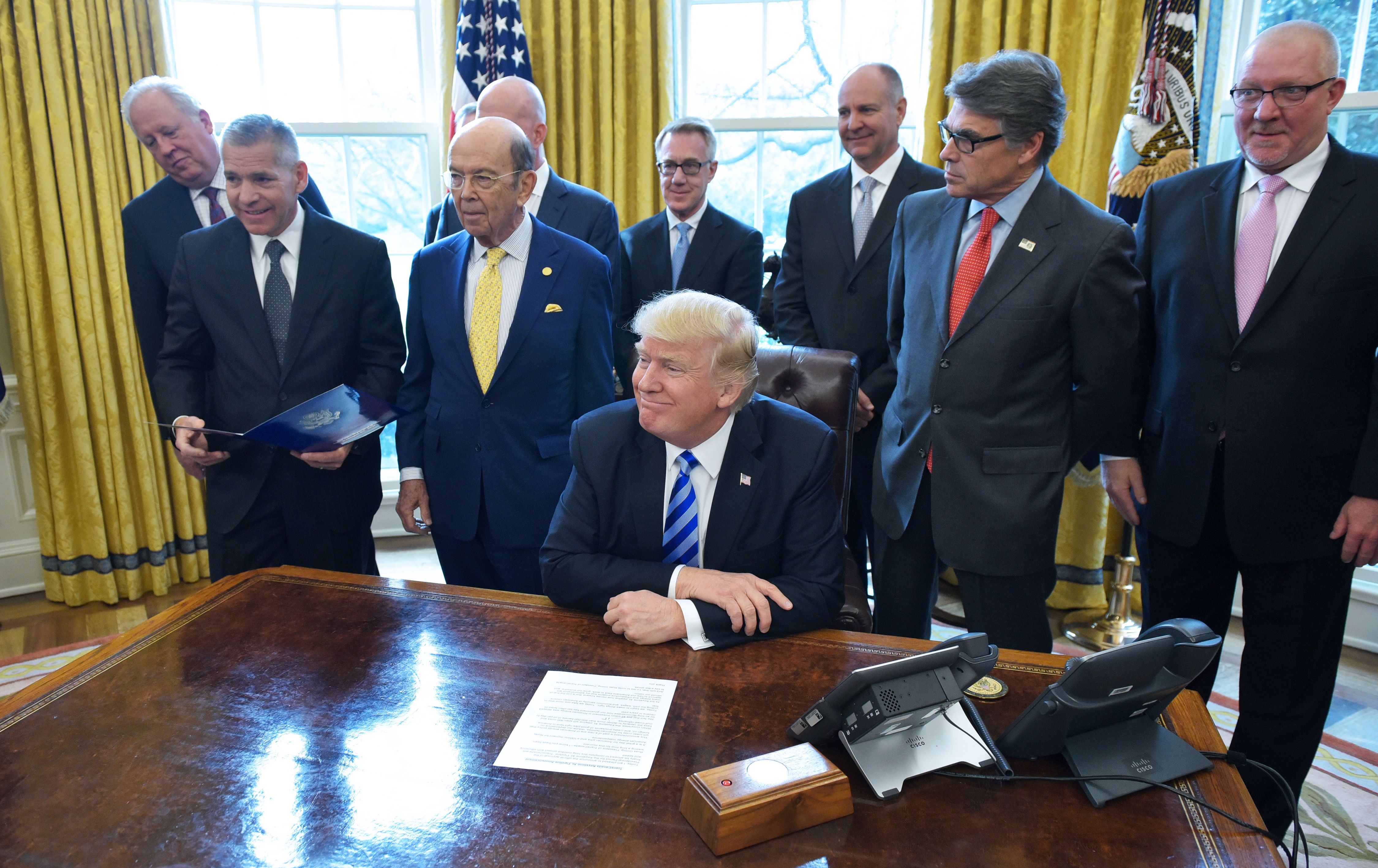 President Donald Trump smiles after announcing approval of the Keystone XL Pipeline in the Oval Office on March 24, 2017 in Washington, DC. CREDIT: MANDEL NGAN/AFP/Getty Images