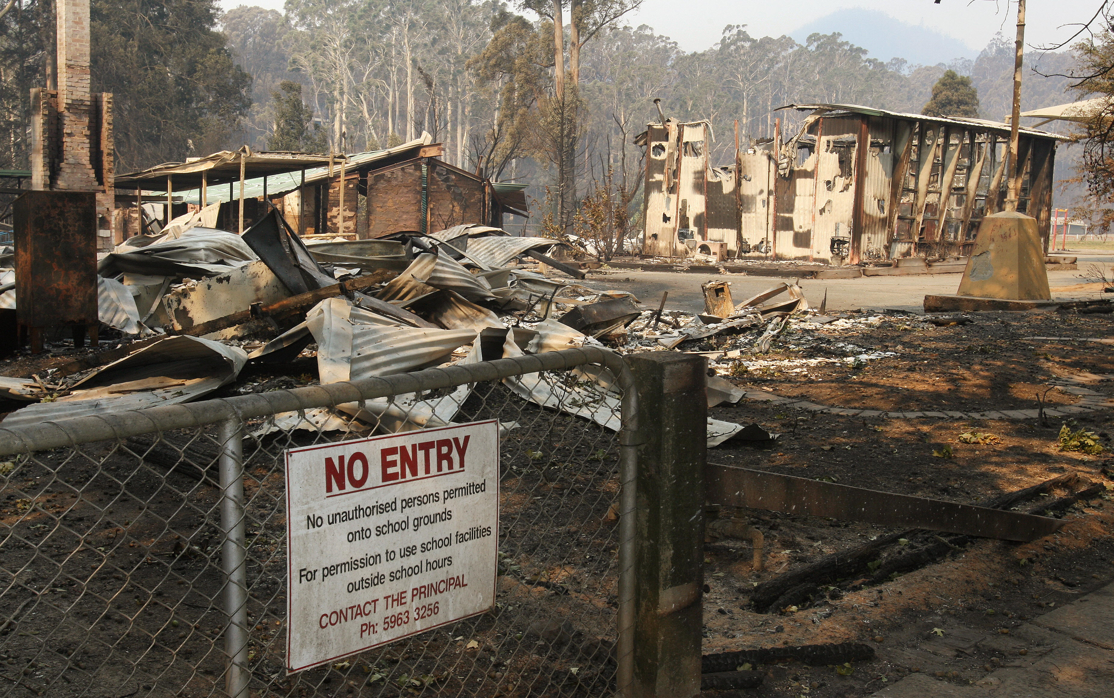 The Marysville primary school lies in ruins after the bushfires destroyed the town, some 100 kilometres northeast of Melbourne on February 9, 2009 as raging Australian wildfires left at least 131 people dead amid a landscape of charred homes, bodies and devastated communities. (Credit: WILLIAM WEST/AFP/Getty Images)