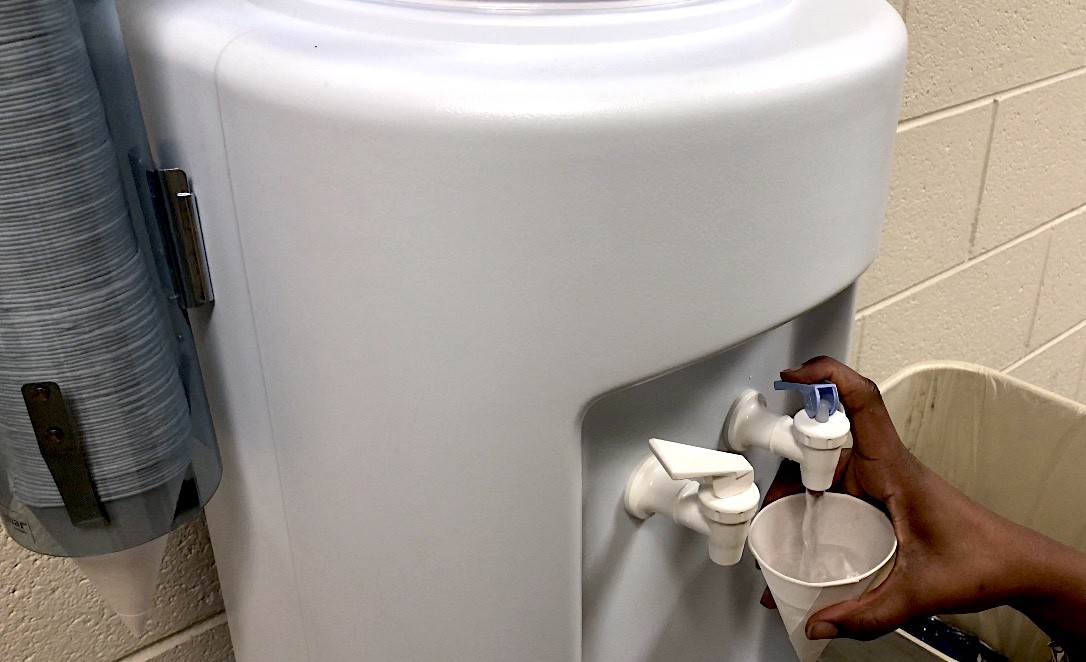 Southeastern math teacher Kiarra Ambrose uses a water cooler. CREDIT: Sierra Searcy