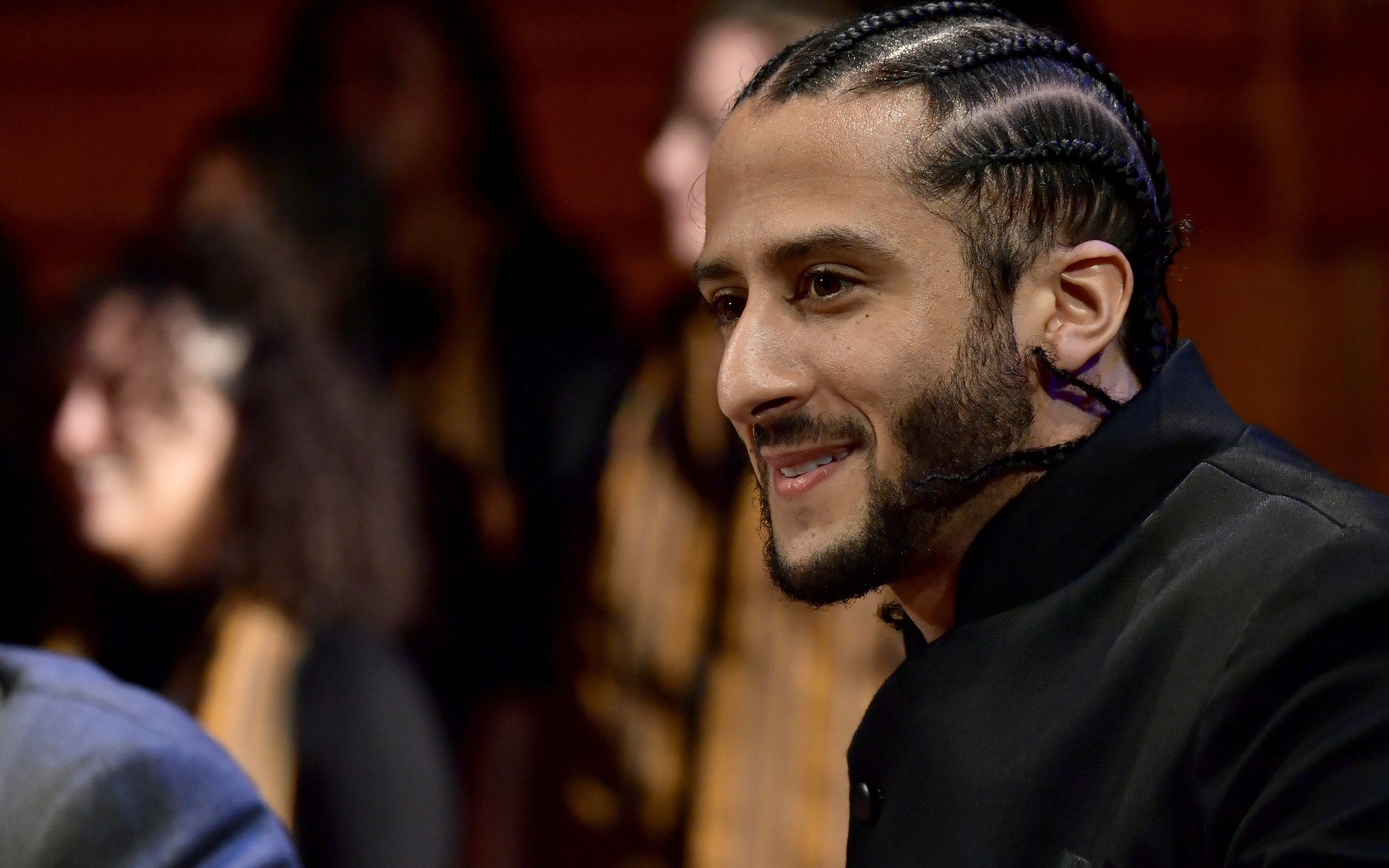 CAMBRIDGE, MA - OCTOBER 11: Colin Kaepernick on stage at the W.E.B. Du Bois Medal Award Ceremony at Harvard University on October 11, 2018 in Cambridge, Massachusetts. Credit: Paul Marotta/Getty Images