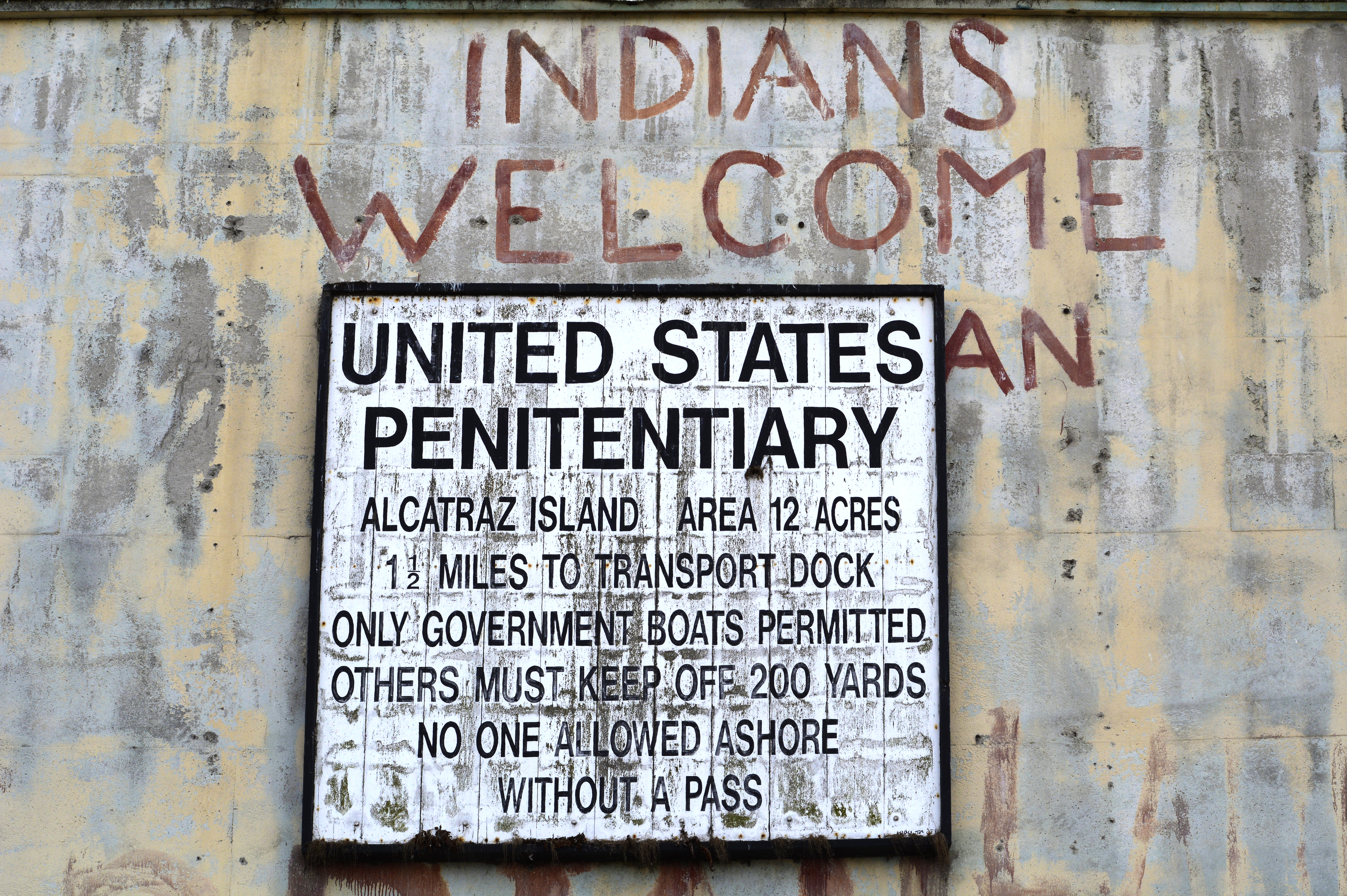 SAN FRANCISCO, CALIFORNIA - SEPTEMBER 12, 2018: A sign greets visitors as they arrive at Alcatraz Island in San Francisco Bay, the home of Alcatraz Federal Penitentiary. Now a museum, the prison (often referred to as 'The Rock') is managed by the U.S. National Park Service. The federal prison was in operation from 1934 until 1963. Graffiti on the walls was left by Native-American activists who occupied the island from 1969 until 1971. The former penitentiary is the most popular tourist attraction in San Francisco, California. (Photo by Robert Alexander/Getty Images)