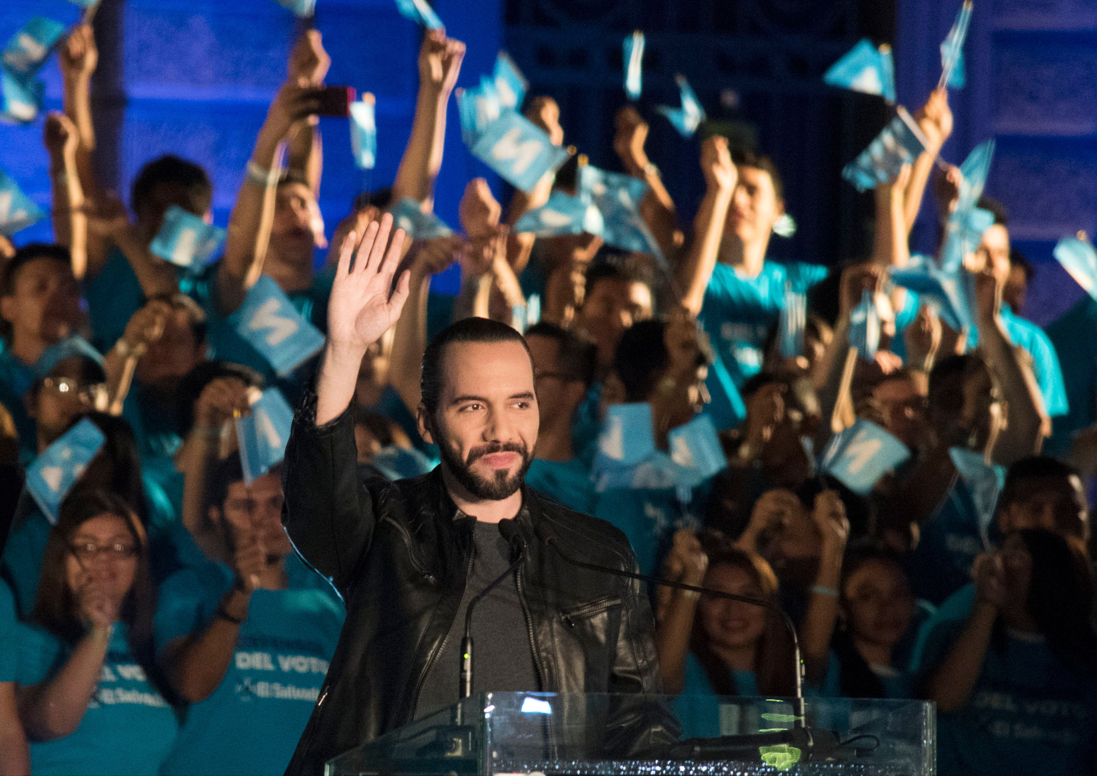Salvadorean presidential candidate Nayib Bukele, of the Great National Alliance (GANA), waves at supporters during the closing rally of his campaign in San Salvador, on January 26, 2019 ahead of the first round of the national election on February 3. (Credit: OSCAR RIVERA/AFP/Getty Images)
