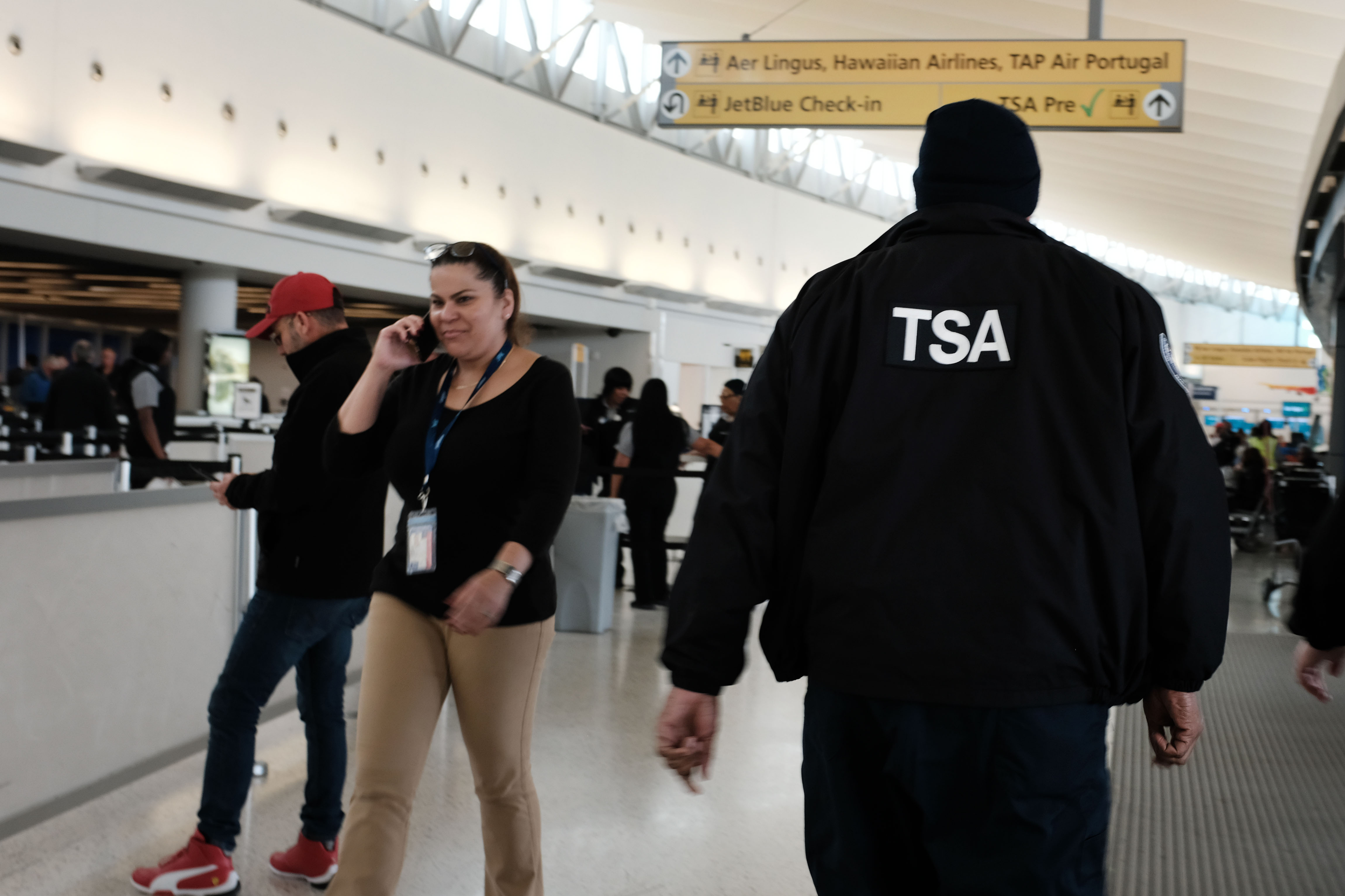 Transportation Security Administration (TSA) agent walks through JFK airport on January 09, 2019. Credit: Spencer Platt/Getty Images)