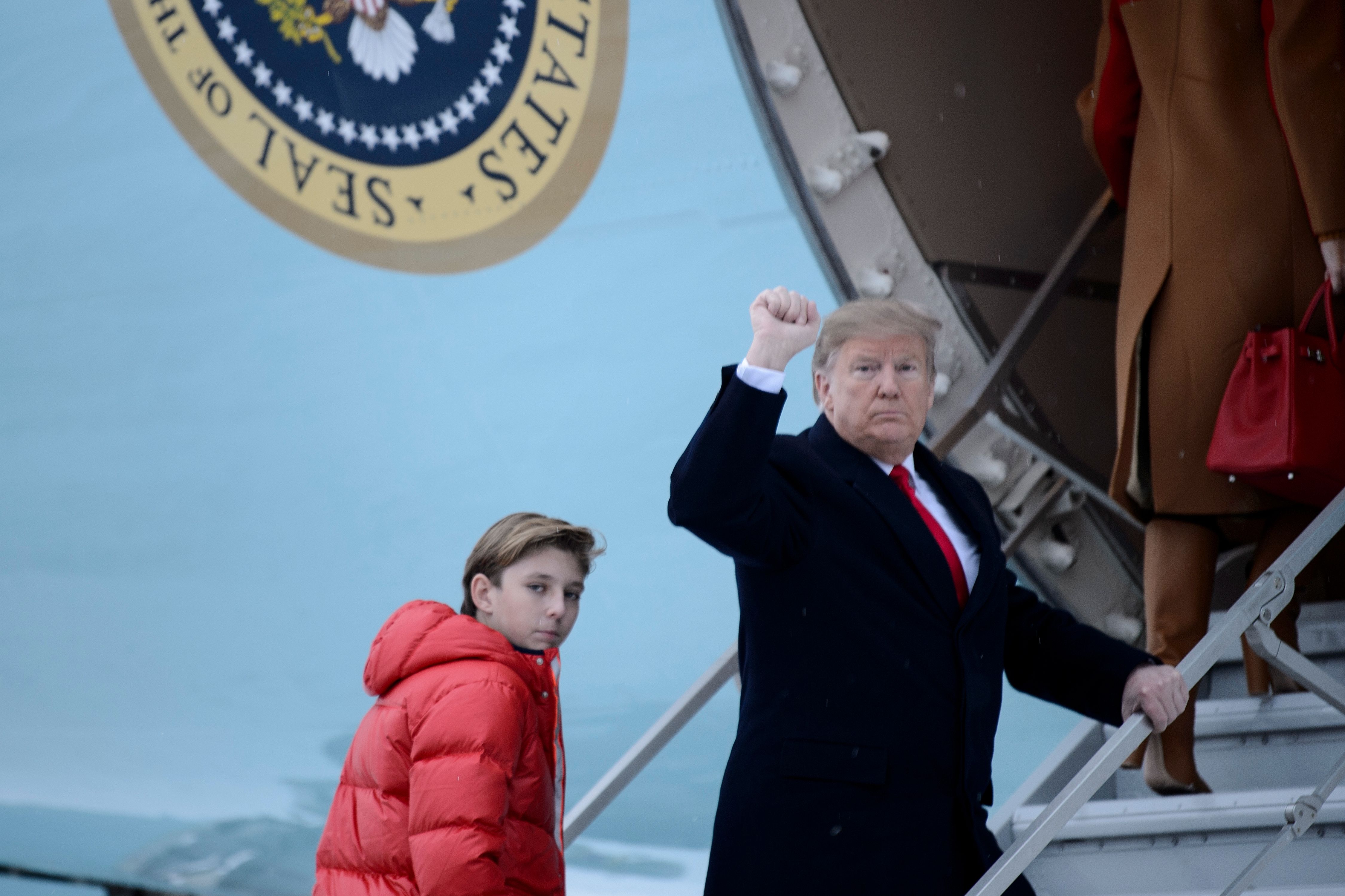 In this file photo taken on February 1, 2019 US President Donald Trump and son Barron Trump board Air Force One at Andrews Air Force Base in Maryland, en route to Palm Beach, Florida. (Credit: Brendan Smialowski / AFP) (Photo credit should read BRENDAN SMIALOWSKI/AFP/Getty Images)