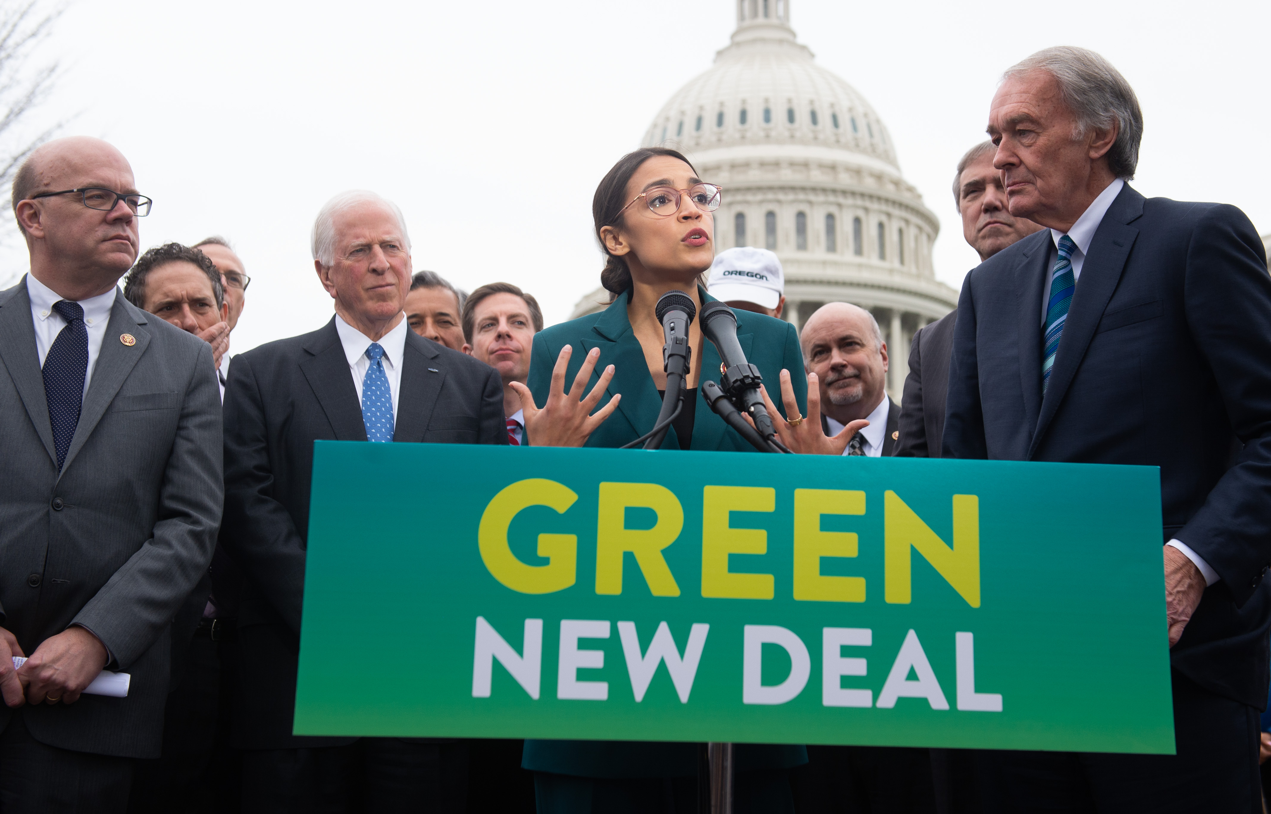 US Representative Alexandria Ocasio-Cortez, Democrat of New York, and US Senator Ed Markey (R), Democrat of Massachusetts, speak during a press conference to announce Green New Deal legislation to promote clean energy programs outside the US Capitol in Washington, DC, February 7, 2019. CREDIT: SAUL LOEB/AFP/Getty Images