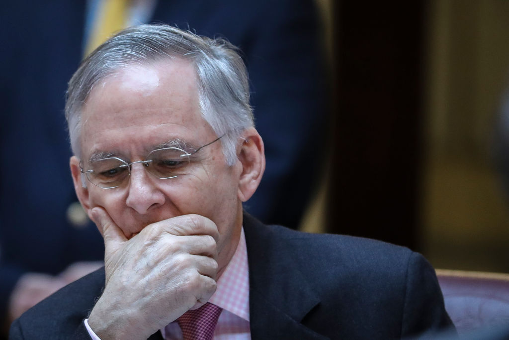 Virginia Senate Majority Leader Tommy Norment (R) sits at his desk on the Senate floor at the Virginia State Capitol