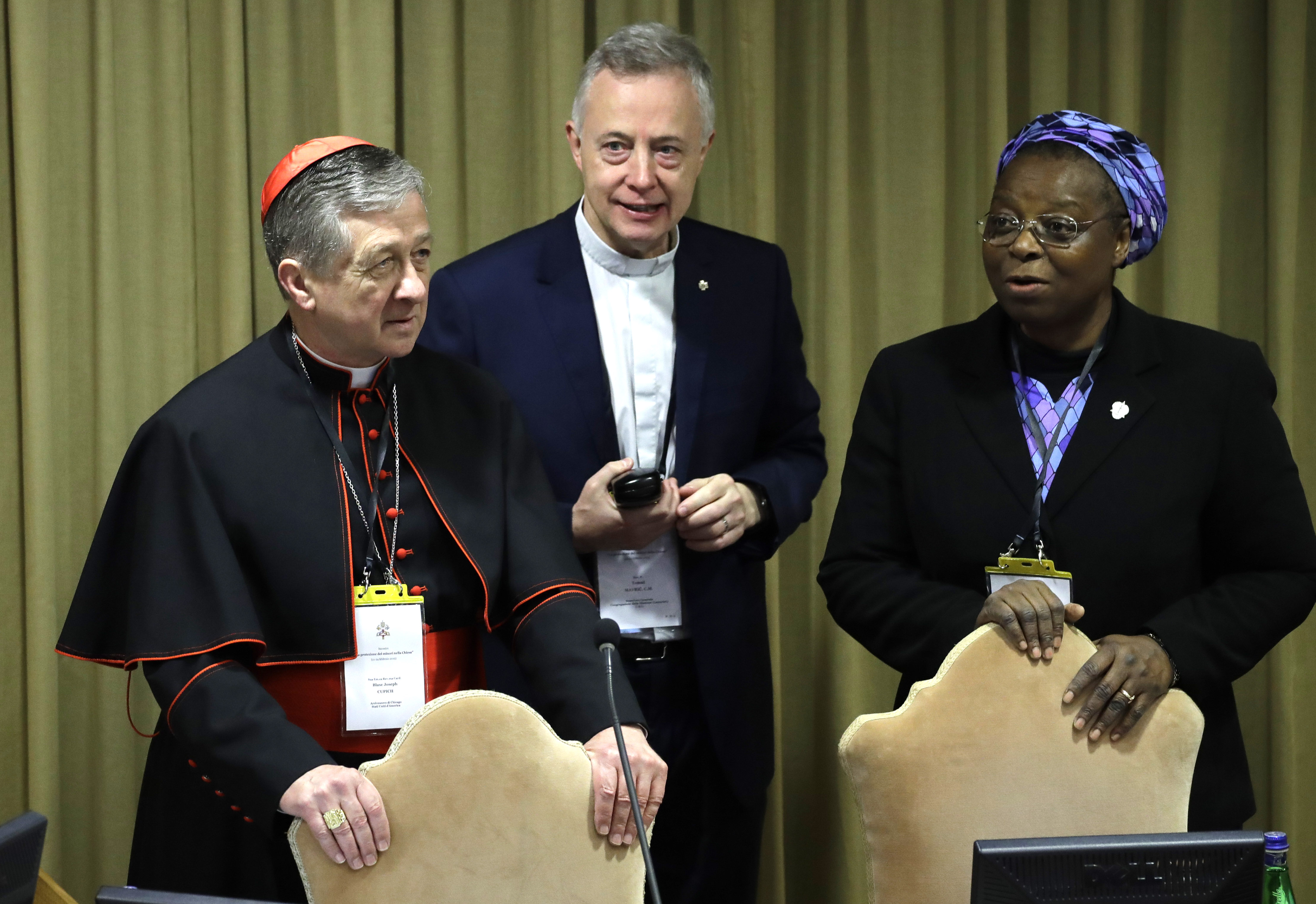 Sister Veronica Openibo (R) stands next to Chicago Archbishop Cardinal Blase J. Cupich (L) and Father Tomaz Mavric as they wait for the Pope's arrival at the beginning of the third day of a Vatican's conference on dealing with sex abuse within the Catholic Church worldwide, on february 23, 2019 at the Vatican. (Photo by Alessandra Tarantino / POOL / AFP) (Photo credit should read ALESSANDRA TARANTINO/AFP/Getty Images)