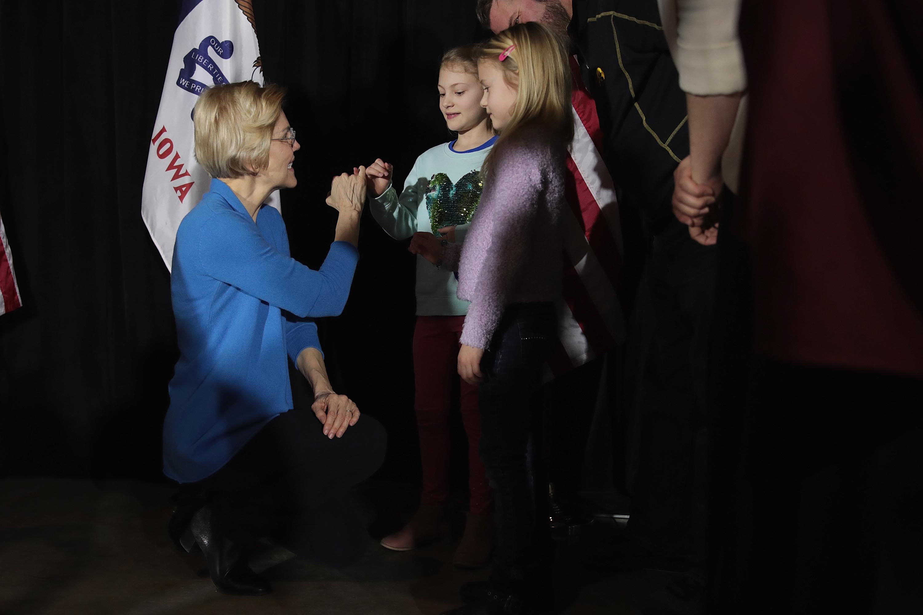 Sen. Elizabeth Warren (D-MA) greets guests during a campaign stop in Cedar Rapids, Iowa. CREDIT: Scott Olson/Getty Images