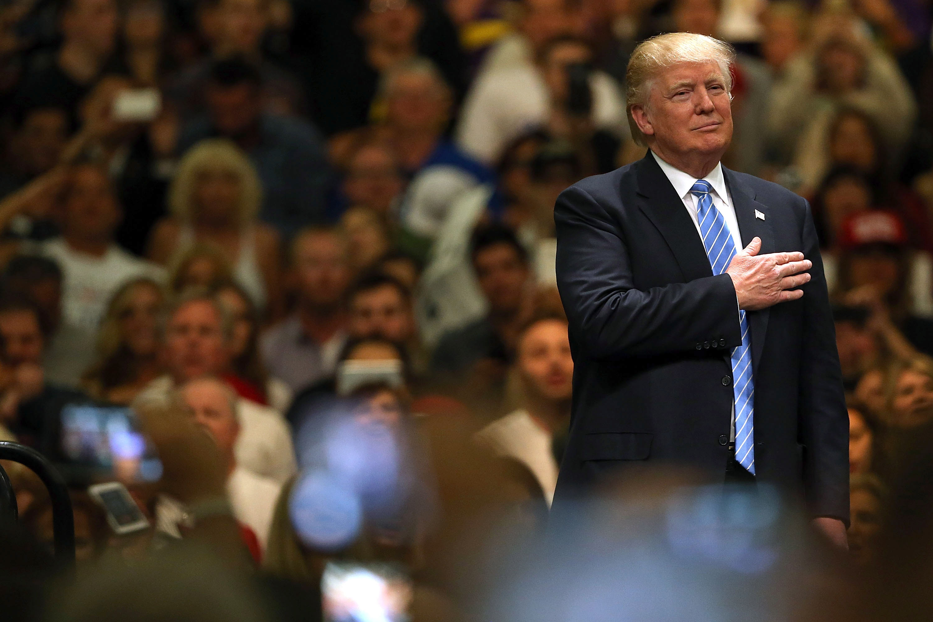 Donald Trump stands for the Pledge of Allegiance. (CREDIT: Spencer Platt/Getty Images)