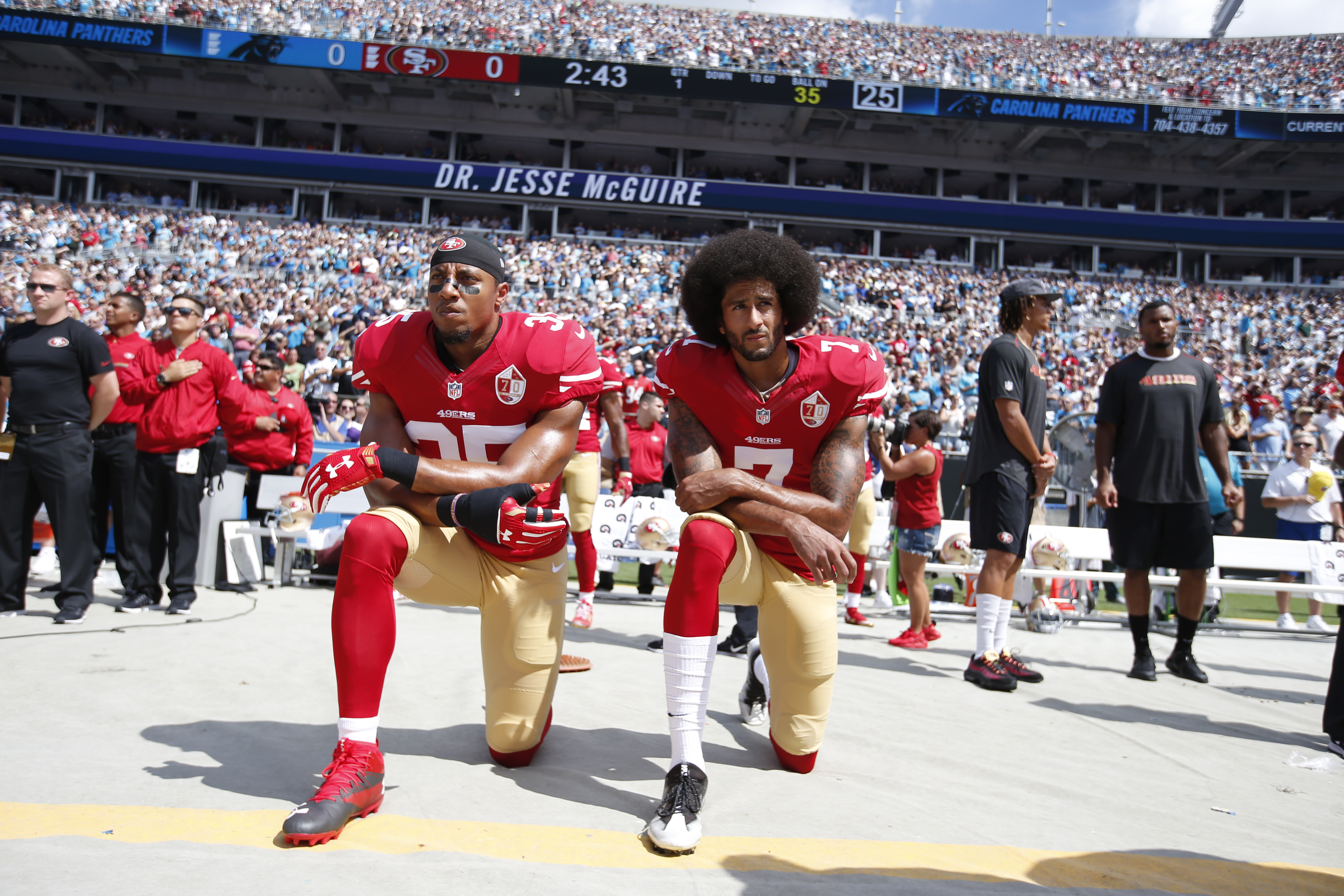 CHARLOTTE, NC - SEPTEMBER 18: Eric Reid #35 and Colin Kaepernick #7 of the San Francisco 49ers kneel on the sideline, during the anthem, prior to the game against the Carolina Panthers at Bank of America Stadium on September 18, 2016 in Charlotte, North Carolina. The Panthers defeated the 49ers 46-27. (Photo by Michael Zagaris/San Francisco 49ers/Getty Images)