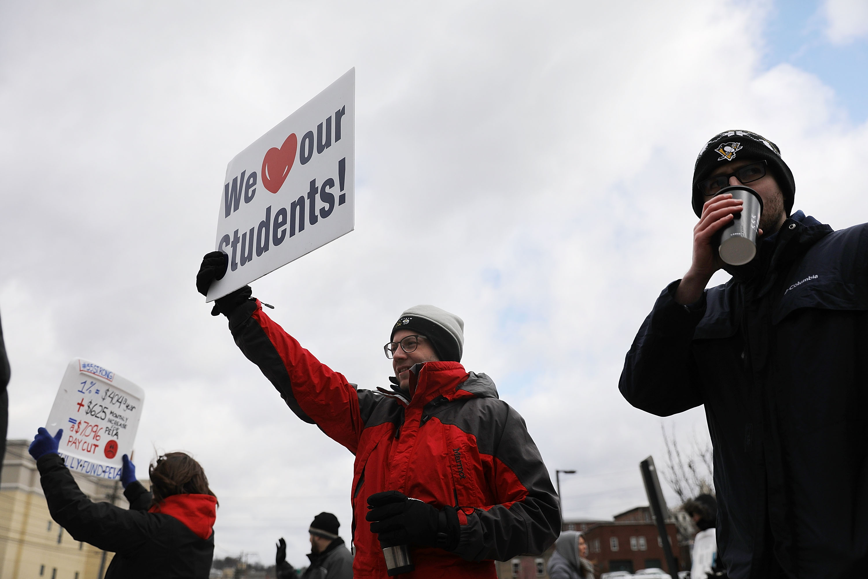 West Virginia teachers, seen here last March on strike alongside students and supporters took to the picket line again on February 19th. (Photo by Spencer Platt/Getty Images)