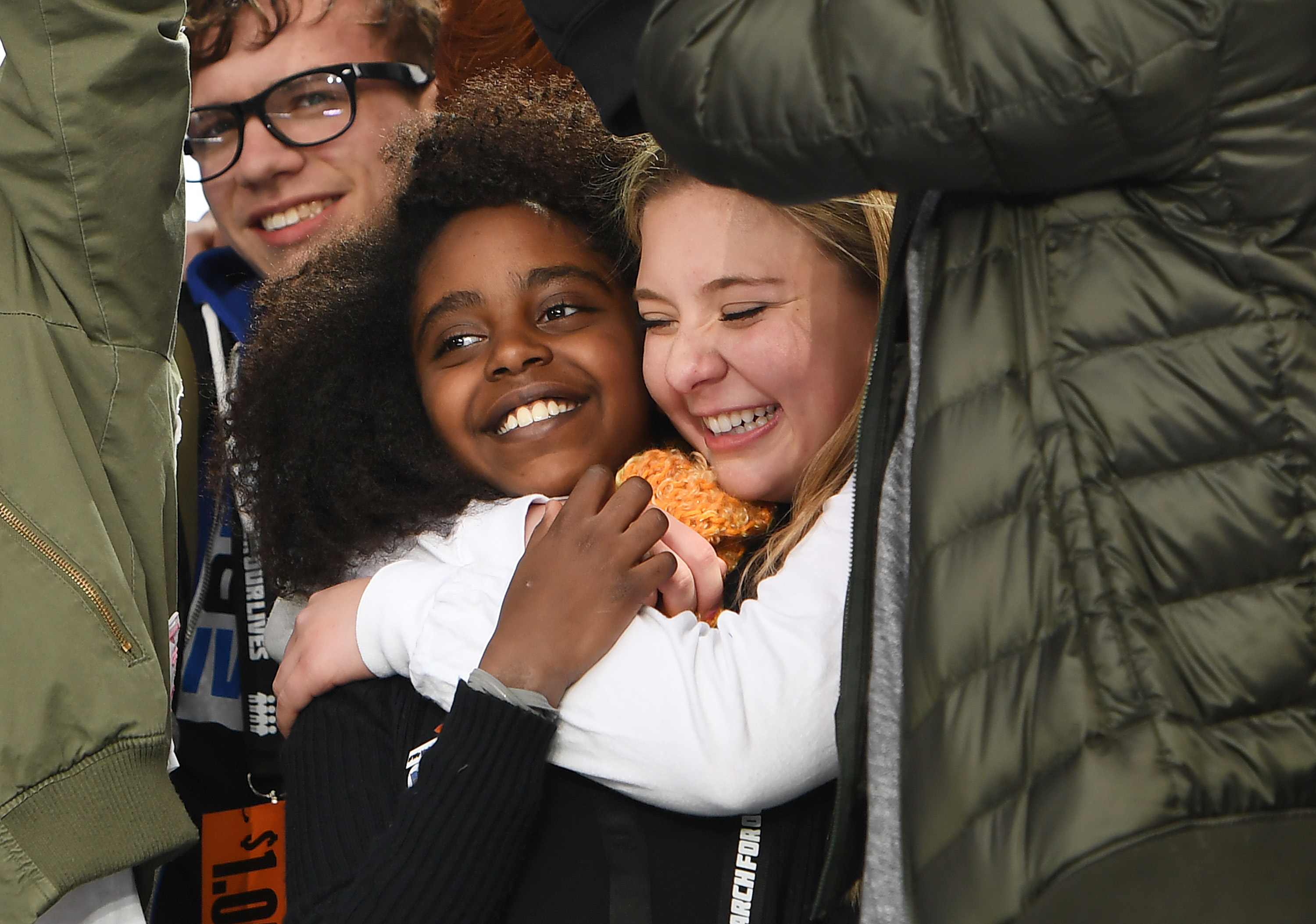 WASHINGTON, DC - MARCH 24: Naomi Wadler, 11, of Alexandria, VA is hugged by Marjory Stoneman Douglas High School student, Jaclyn Corin near the conclusion of March for Our Lives on Saturday March 24, 2018 in Washington, DC. Many students from Marjory Stoneman Douglas High School were in attendance. (Photo by Matt McClain/The Washington Post via Getty Images)