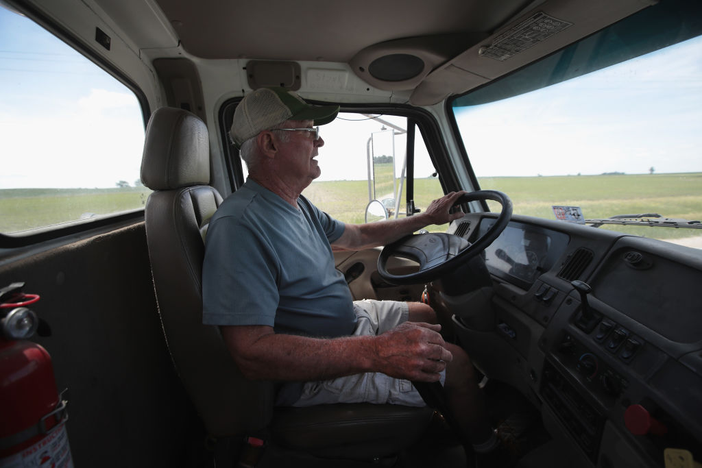 Farmer John Duffy drives a load of soybeans to the grain elevator on June 13, 2018 in Dwight, Illinois. U.S. soybean futures have plunged due to the country's trade war with China. President Donald Trump, however, has claimed China is suffering more as a result of the tariffs he imposed on imports last year. (Photo credit: Scott Olson/Getty Images)