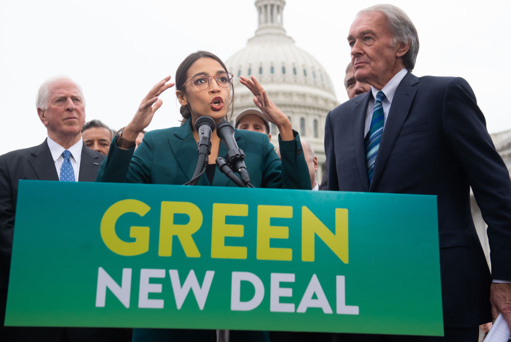 Rep Alexandria Ocasio-Cortez (D-NY) and, on the right, Sen. Ed Markey (D-MA) announce Green New Deal legislation to promote clean energy outside the US Capitol, February 7, 2019. CREDIT: SAUL LOEB/AFP/Getty Images