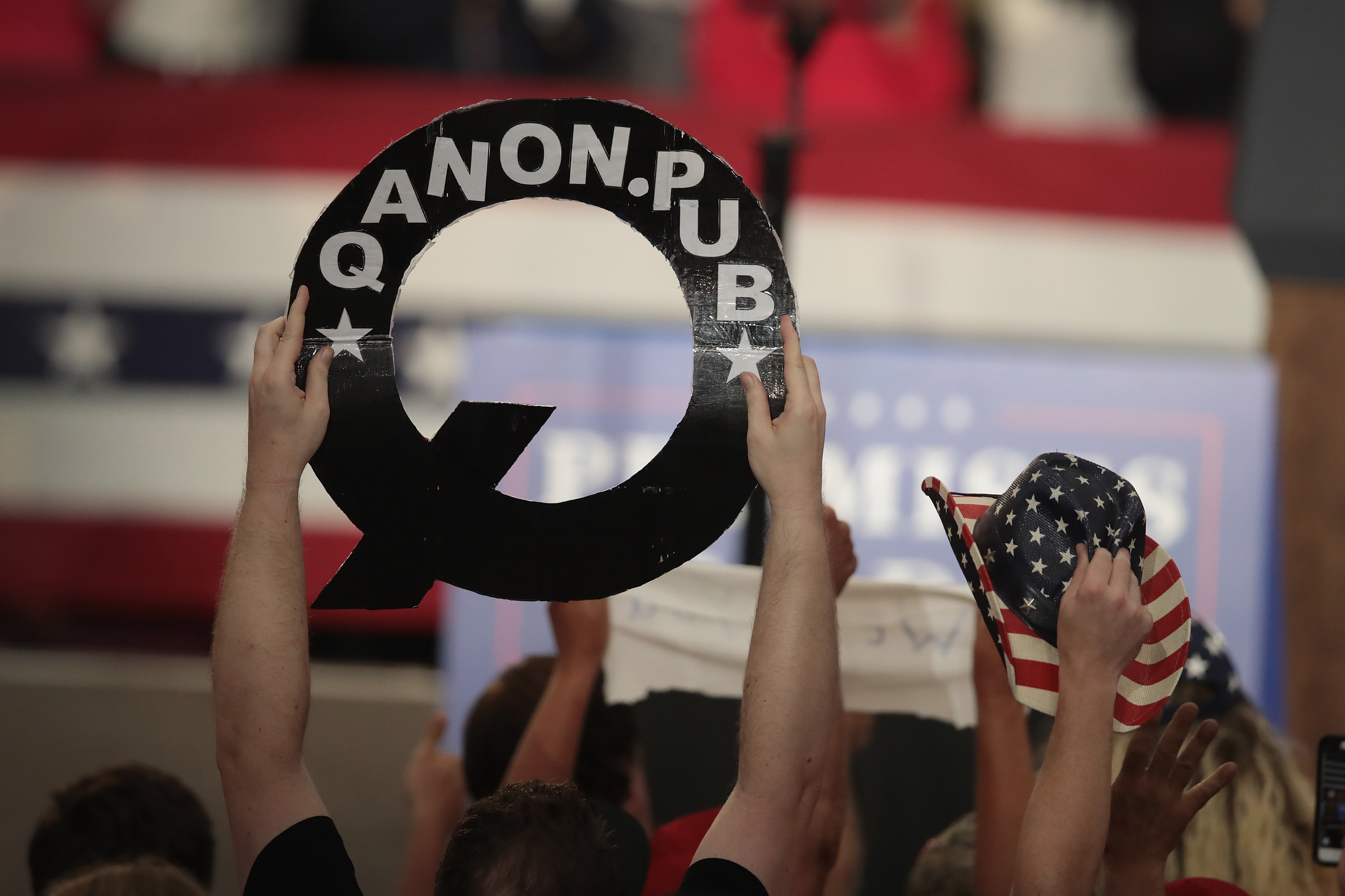 Trump's Michigan rally highlights rise of QAnon conspiracy among his supporters. (Photo credit: Scott Olson/Getty Images)