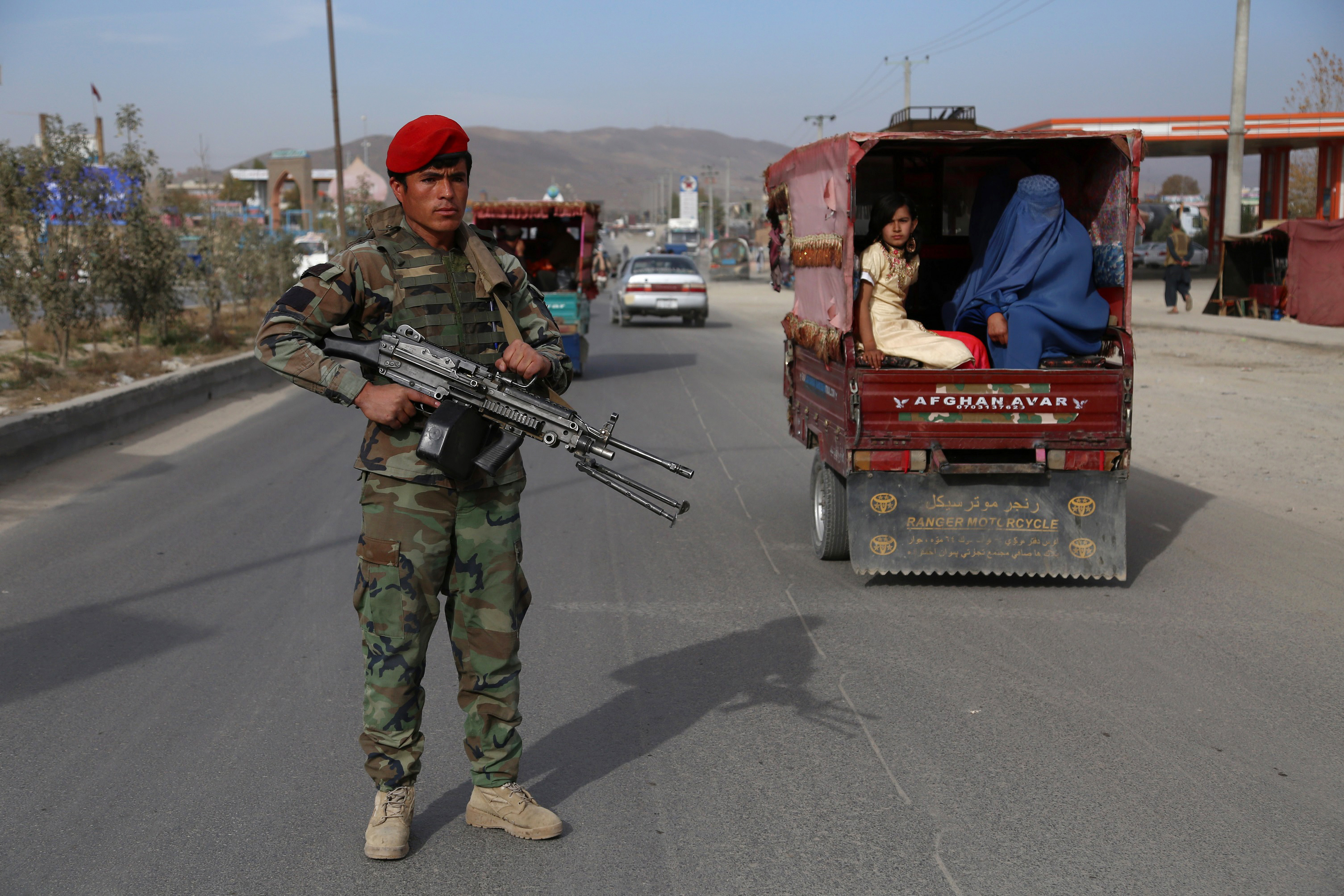 An Afghan security personnel keep watch at a checkpoint on Highway One in Ghazni on Oct. 29, 2018. CREDIT: Zakeria Hashemi/AFP/Getty Images.