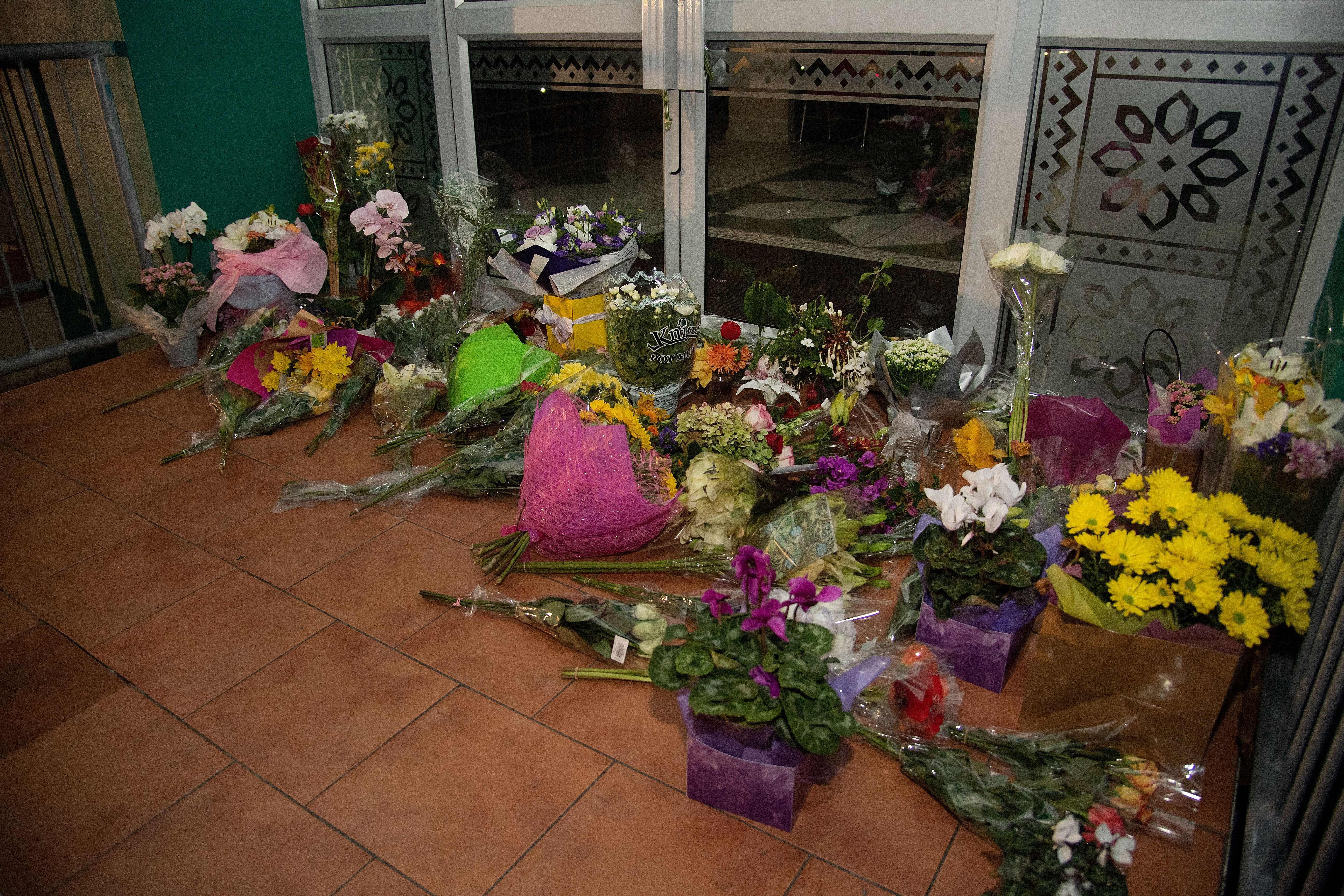 Flowers are placed on the front steps of the Wellington Masjid mosque in Kilbirnie in Wellington on March 15, 2019, after a shooting incident at two mosques in Christchurch. Attacks on two Christchurch mosques left at least 49 dead on March 15, with one gunman -- identified as an Australian extremist -- apparently livestreaming the assault that triggered the lockdown of the New Zealand city. (Photo credit: MARTY MELVILLE/AFP/Getty Images)
