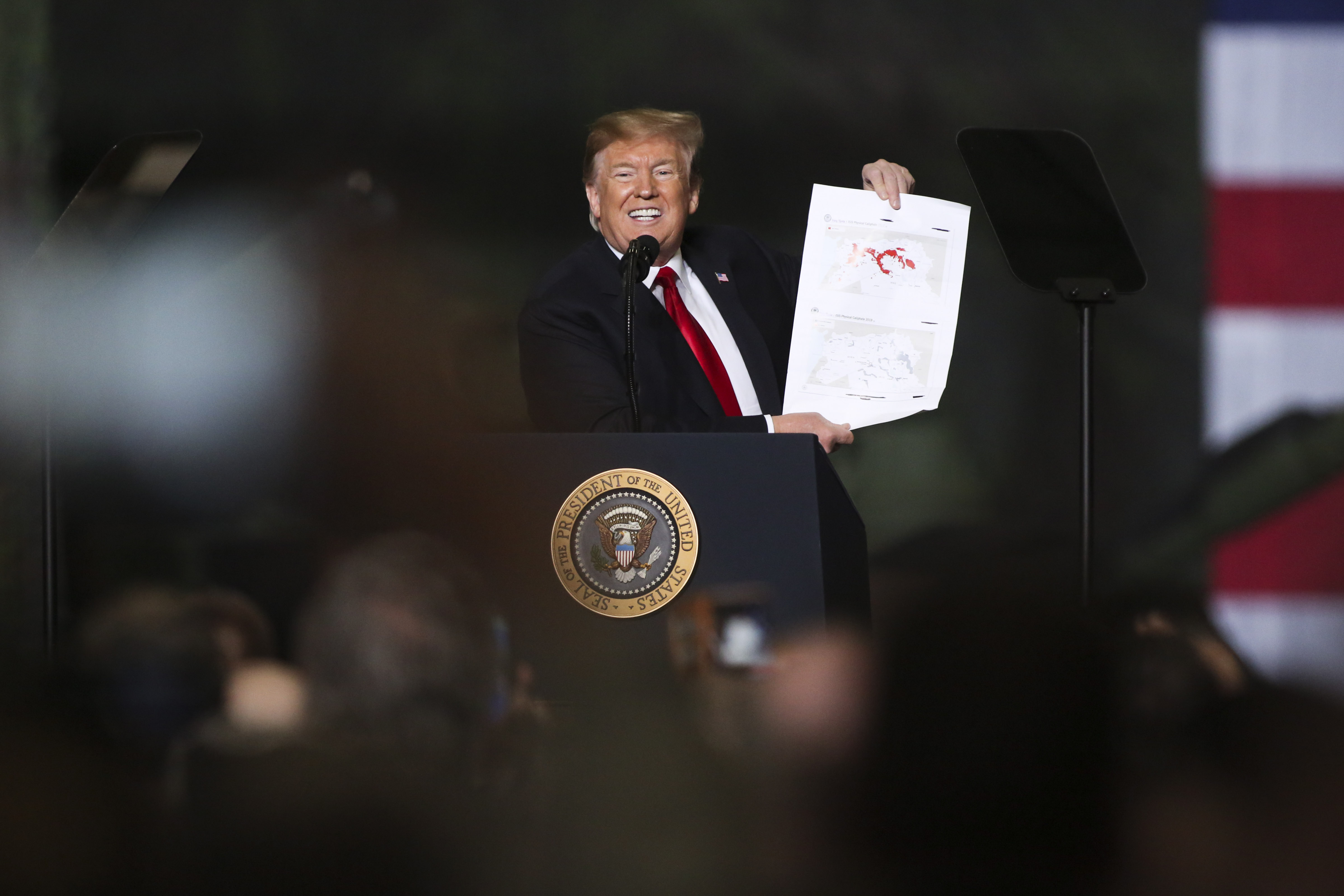 President Donald Trump speaks at the Joint Systems Manufacturer on March 20, 2019 in Lima, Ohio, where he also used the map showing diminishing ISIS-held territory as a visual aid. (PHOTO CREDIT: Andrew Spear/Getty Images)