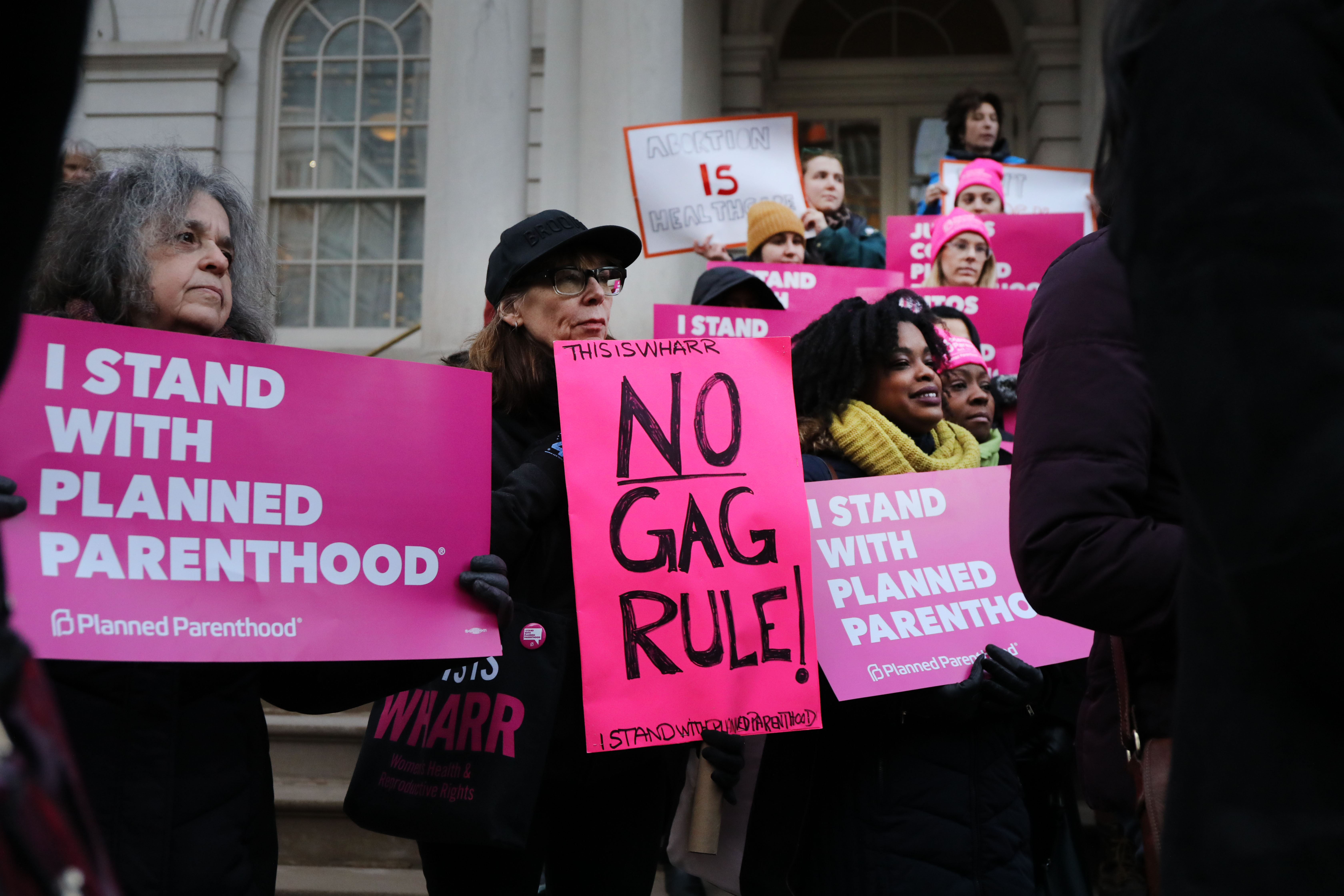 Pro-choice activists, politicians and others associated with Planned Parenthood gather for a news conference and demonstration at City Hall against the Trump administrations title X rule change on February 25, 2019 in New York City. The proposed final rule for the Title X Family Planning Program, called the “Gag Rule,” would force a medical provider receiving federal assistance to refuse to promote, refer for, perform or support abortion as a method of family planning. (Photo Credit: Spencer Platt/Getty Images)