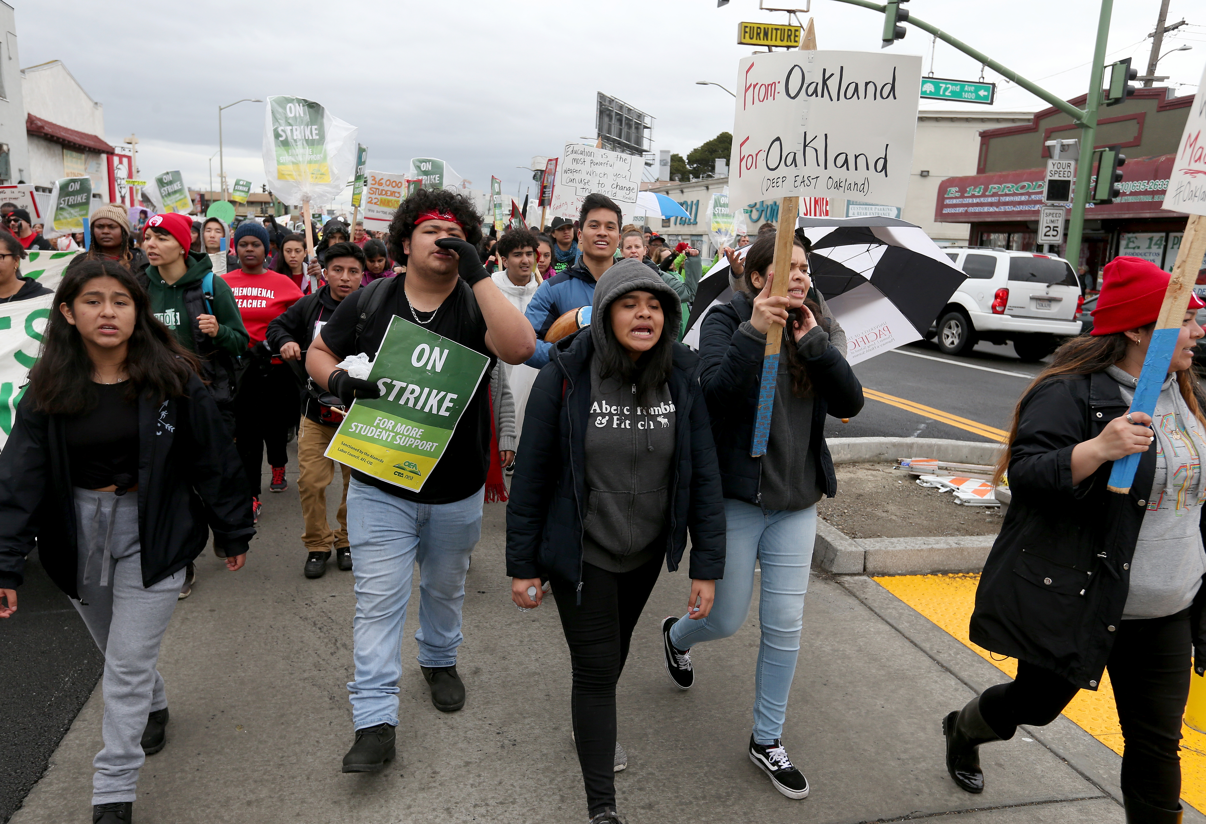 OAKLAND, CA - FEB. 26: Teachers, students and supporters march down International Boulevard towards a rally at Roots International Academy in Oakland, Calif., on Tuesday, Feb. 26, 2019. This is the fourth day of their strike. (Photo by Jane Tyska/MediaNews Group/The Mercury News via Getty Images)