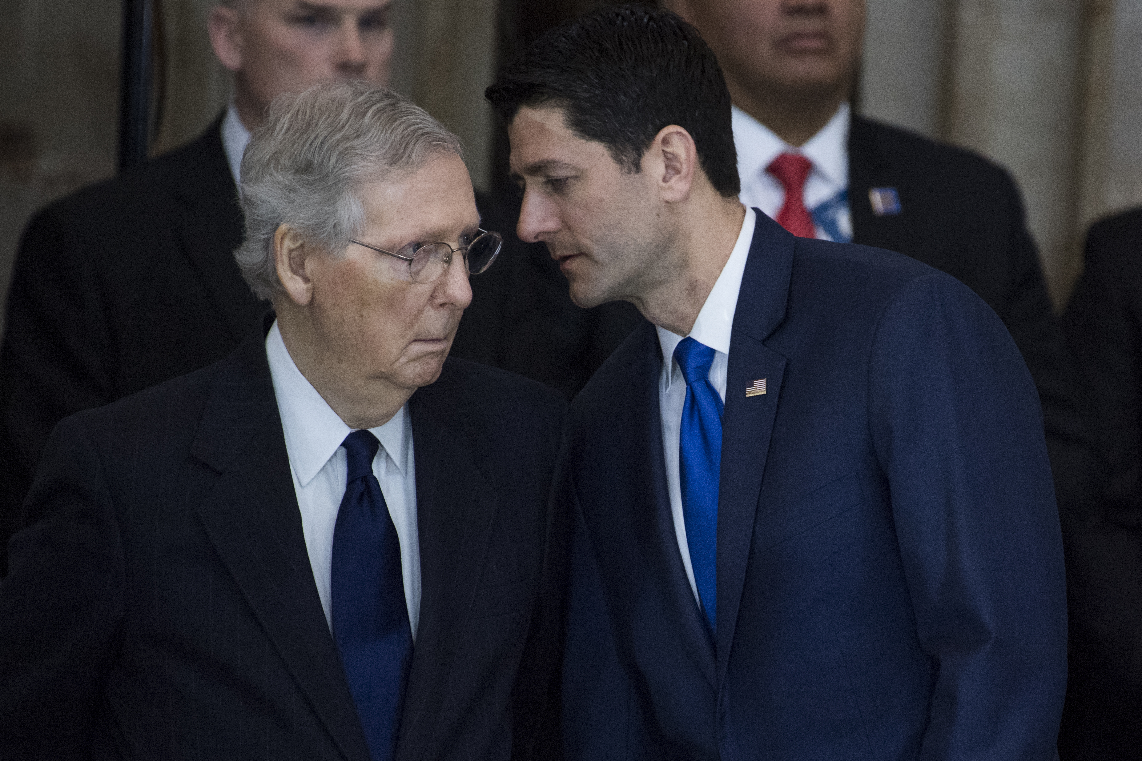 Democrats are now leading the investigations into Trump and Russia that Sen. Mitch McConnell (left) and former Rep. Paul Ryan (right) opted to avoid. CREDIT: TOM WILLIAMS / GETTY