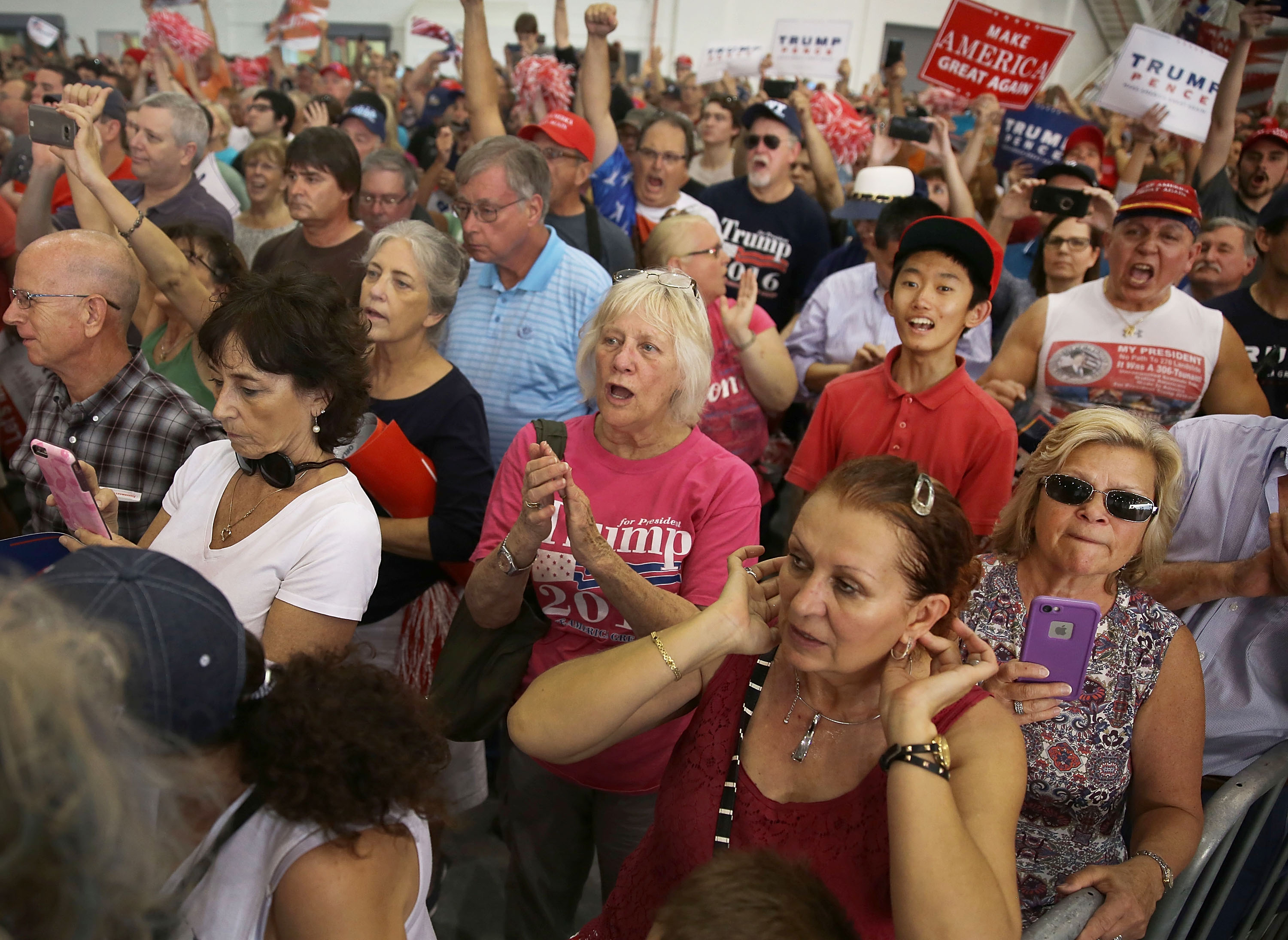 MELBOURNE, FL - FEBRUARY 18: In this file picture from 2017, Cesar Sayoc (far right in red hat) is seen as President Donald Trump speaks during a campaign rally at the AeroMod International hangar at Orlando Melbourne International Airport on February 18, 2017 in Melbourne, Florida. (Photo by Joe Raedle/Getty Images)
