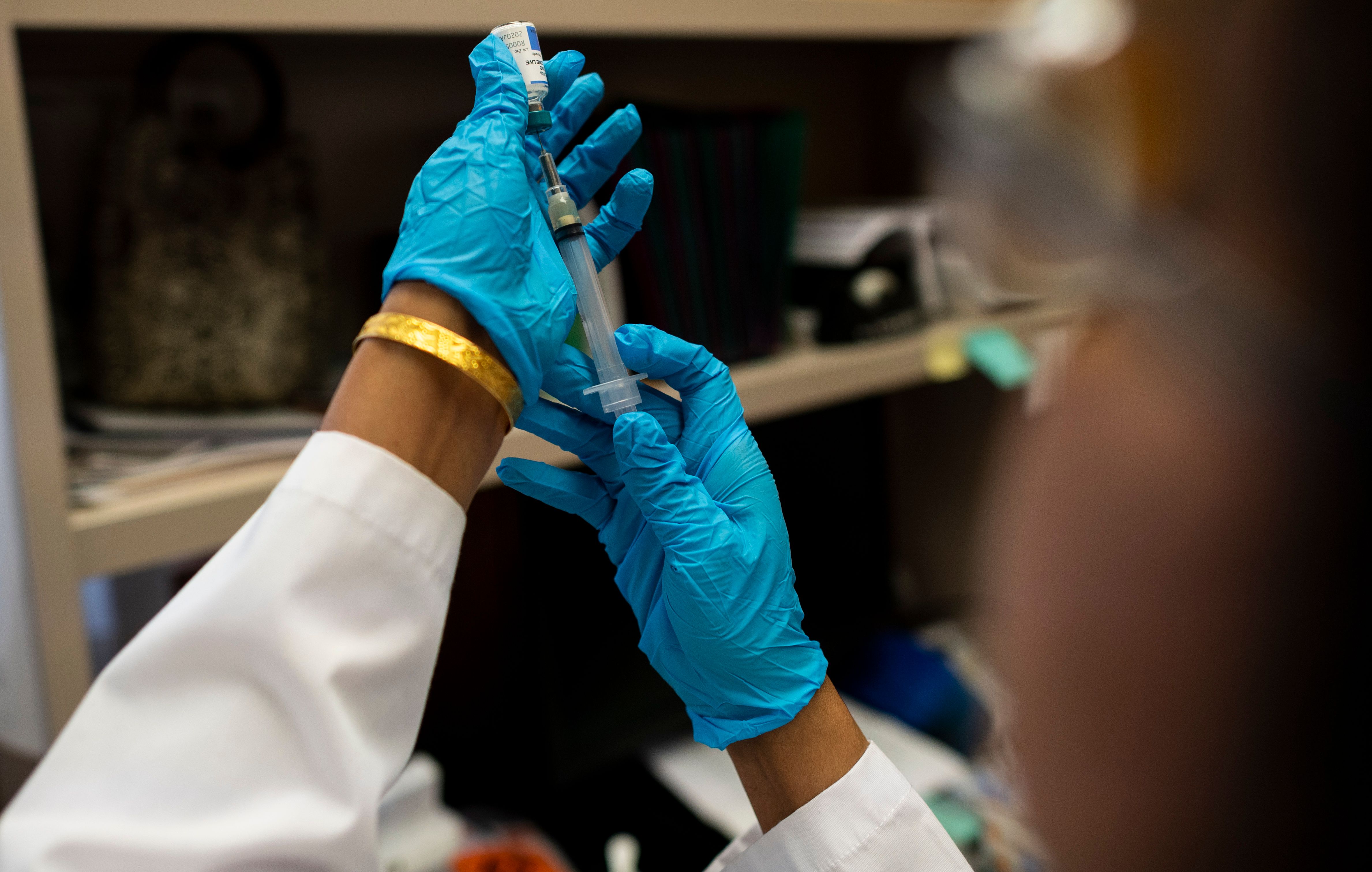 This picture taken on April 5, 2019 shows a nurse preparing the measles, mumps and rubella vaccine at the Rockland County Health Department in Haverstraw, Rockland County, New York. - A measles outbreak in the area has sickened scores of people and caused the county to bar unvaccinated minors in public places. (Photo by Johannes EISELE / AFP) / With AFP Story by Catherine TRIOMPHE: NY county measles outbreak spotlights vaccine religious exemptions (Photo credit should read JOHANNES EISELE/AFP/Getty Images)