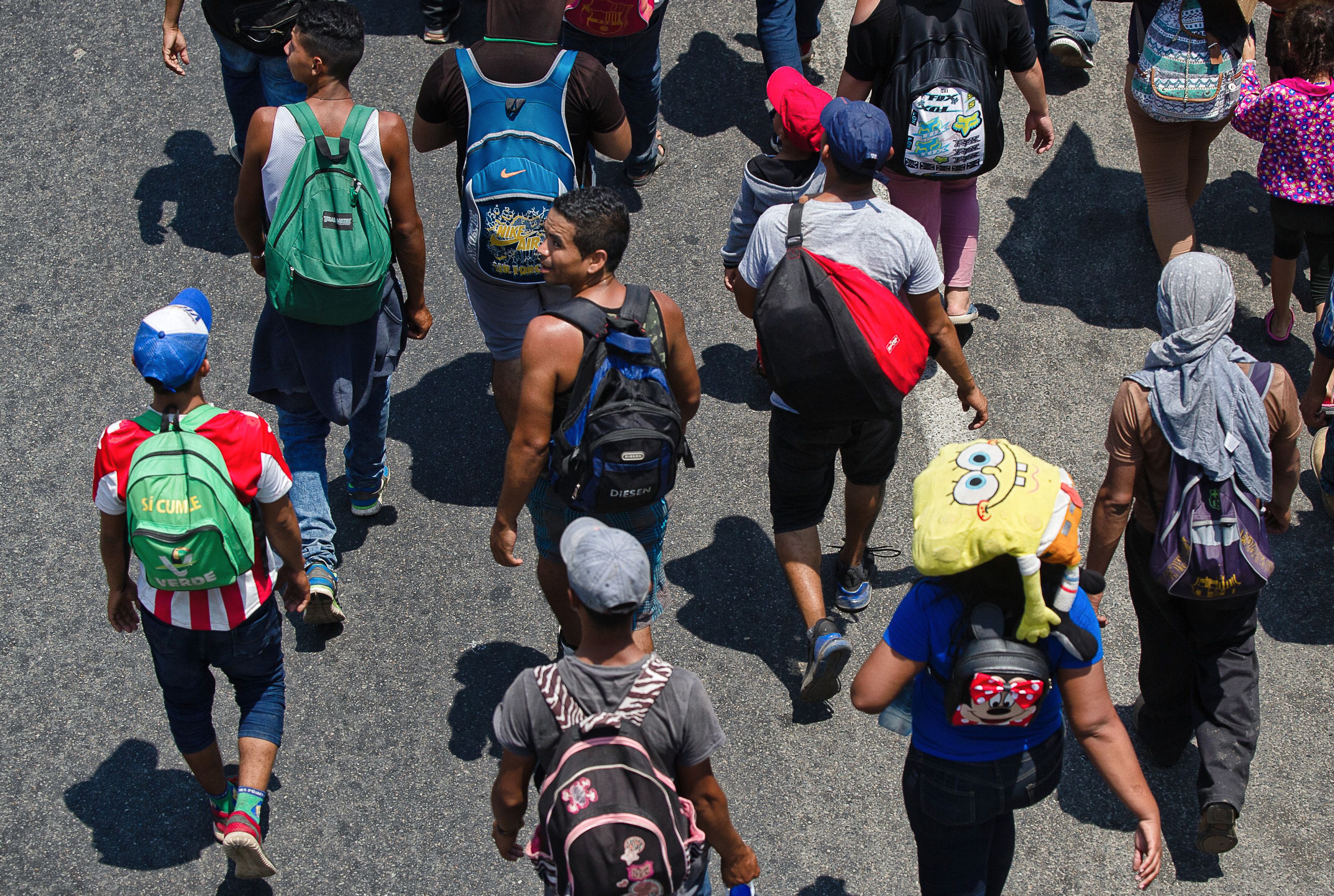 Central American migrants heading in a caravan to the US arrive in Huehuetan, Chiapas state, Mexico, on April 15, 2019. - A group of 350 Central American migrants forced their way into Mexico Friday, authorities said, as a new caravan of around 2,500 people arrived -- news sure to draw the attention of US President Donald Trump. (Photo by PEP COMPANYS / AFP) (Photo credit should read PEP COMPANYS/AFP/Getty Images)
