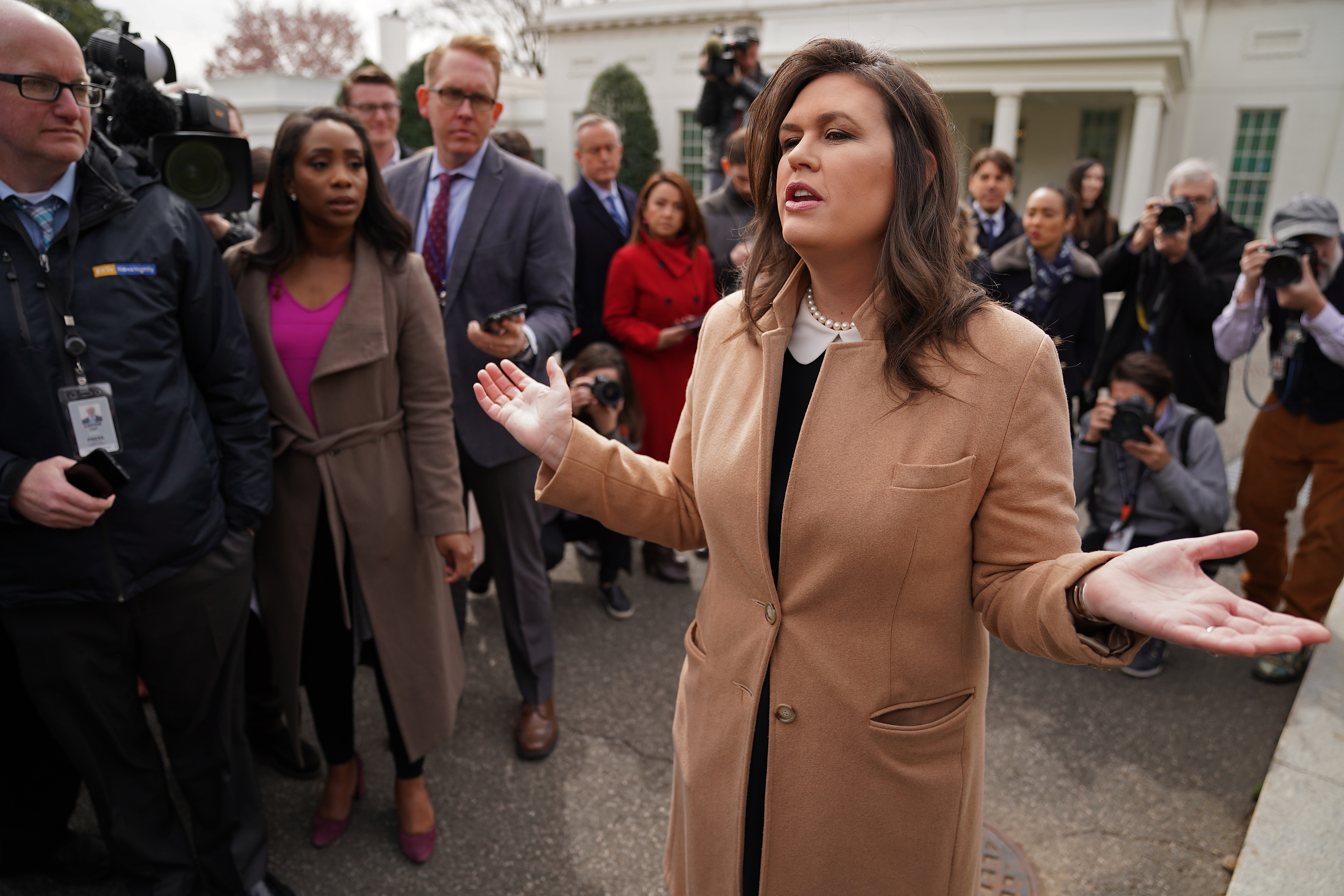 WASHINGTON, DC - APRIL 02: White House Press Secretary Sarah Huckabee Sanders talks to journalists outside the West Wing of the White House April 02, 2019 in Washington, DC. Credit: Chip Somodevilla/Getty Images
