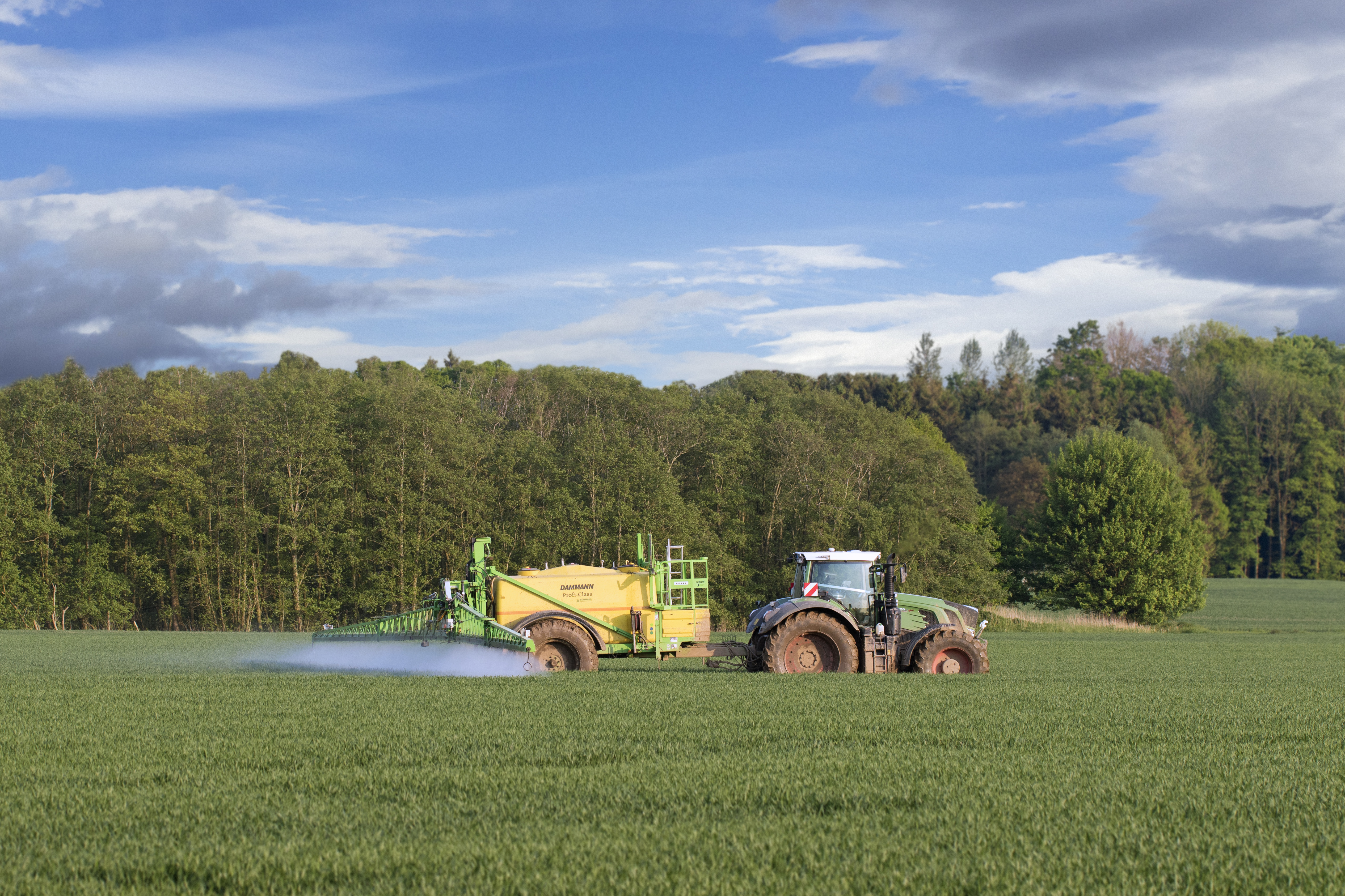 Farmer spraying pesticides over crops. CREDIT: Arterra/UIG via Getty Images