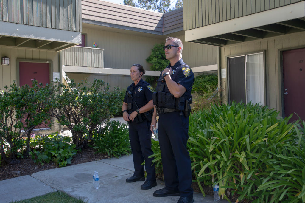 Police stand outside the suspected residence of Isaiah Peoples, who is accused of driving his car into a crowd because he believed some were Muslim. (CREDIT: Karl Mondon/MediaNews Group/The Mercury News via Getty Images)