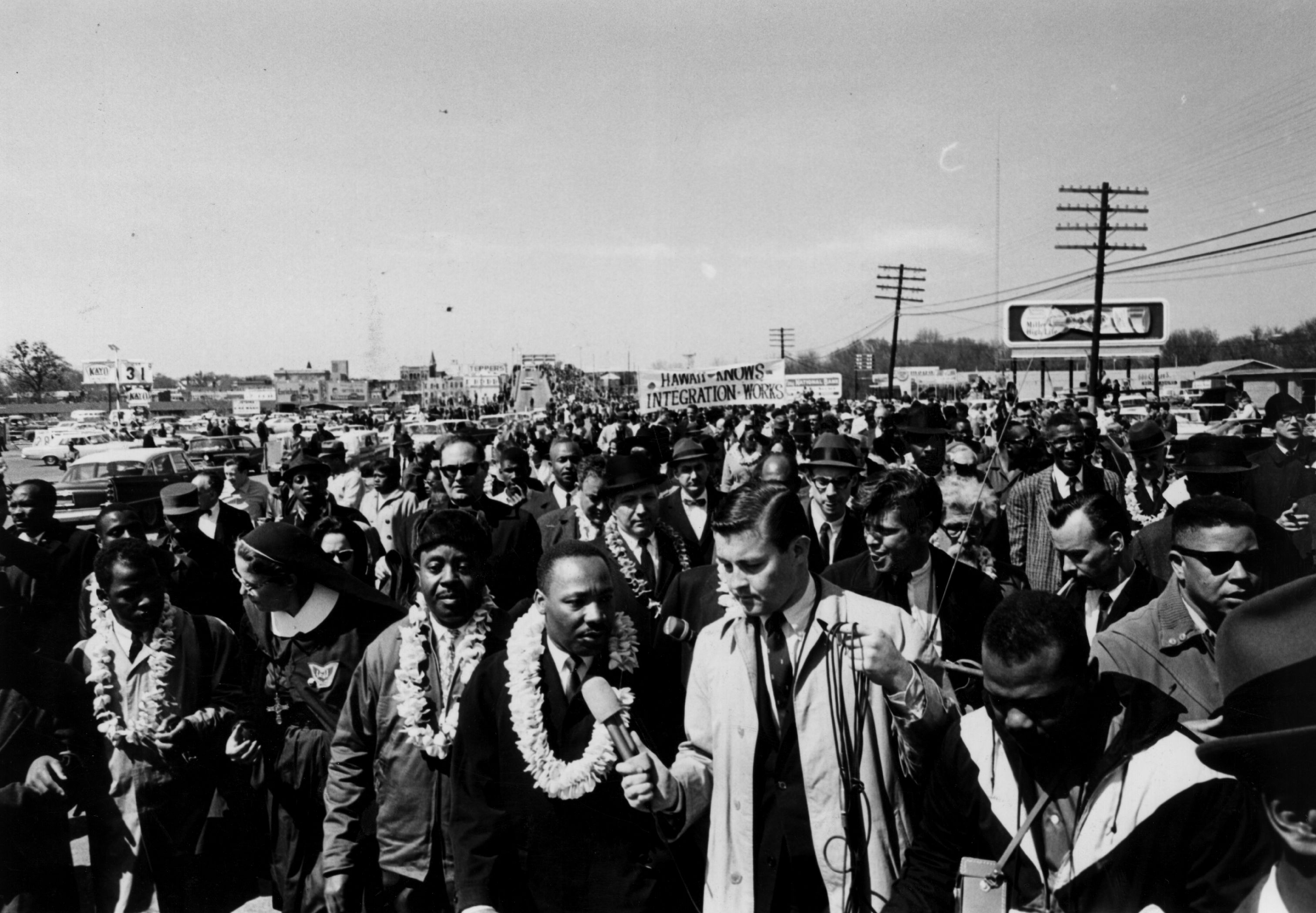 March 1965: Martin Luther King (1929 - 1968) leads the Alabama Civil Rights march, flanked by supporters. Next to him is fellow campaigner Ralph Abernathy (1926 - 1990). (Photo by Express Newspapers/Getty Images)